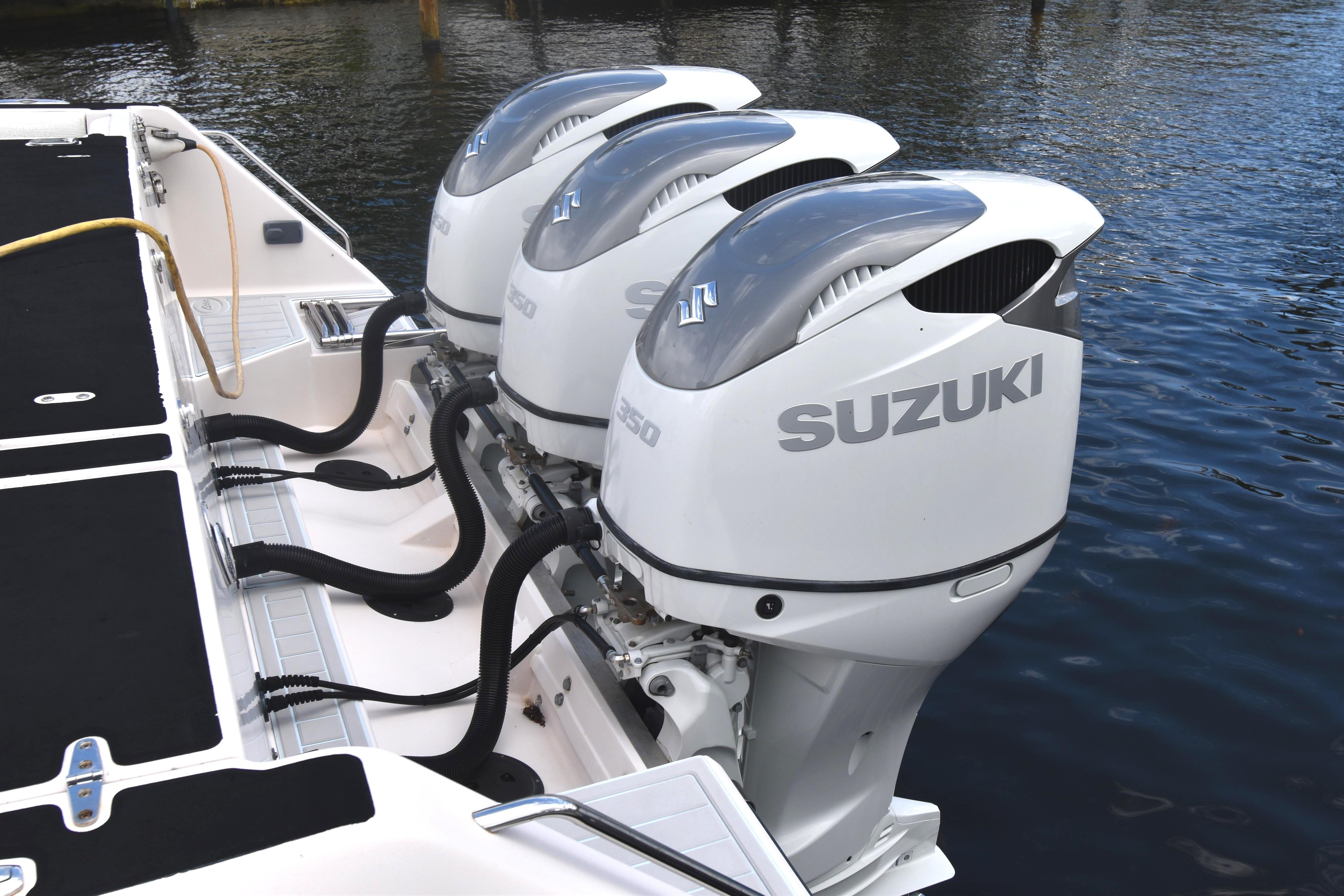 Triple Suzuki outboard engines on a 2010 Grady-White Canyon 366 boat.