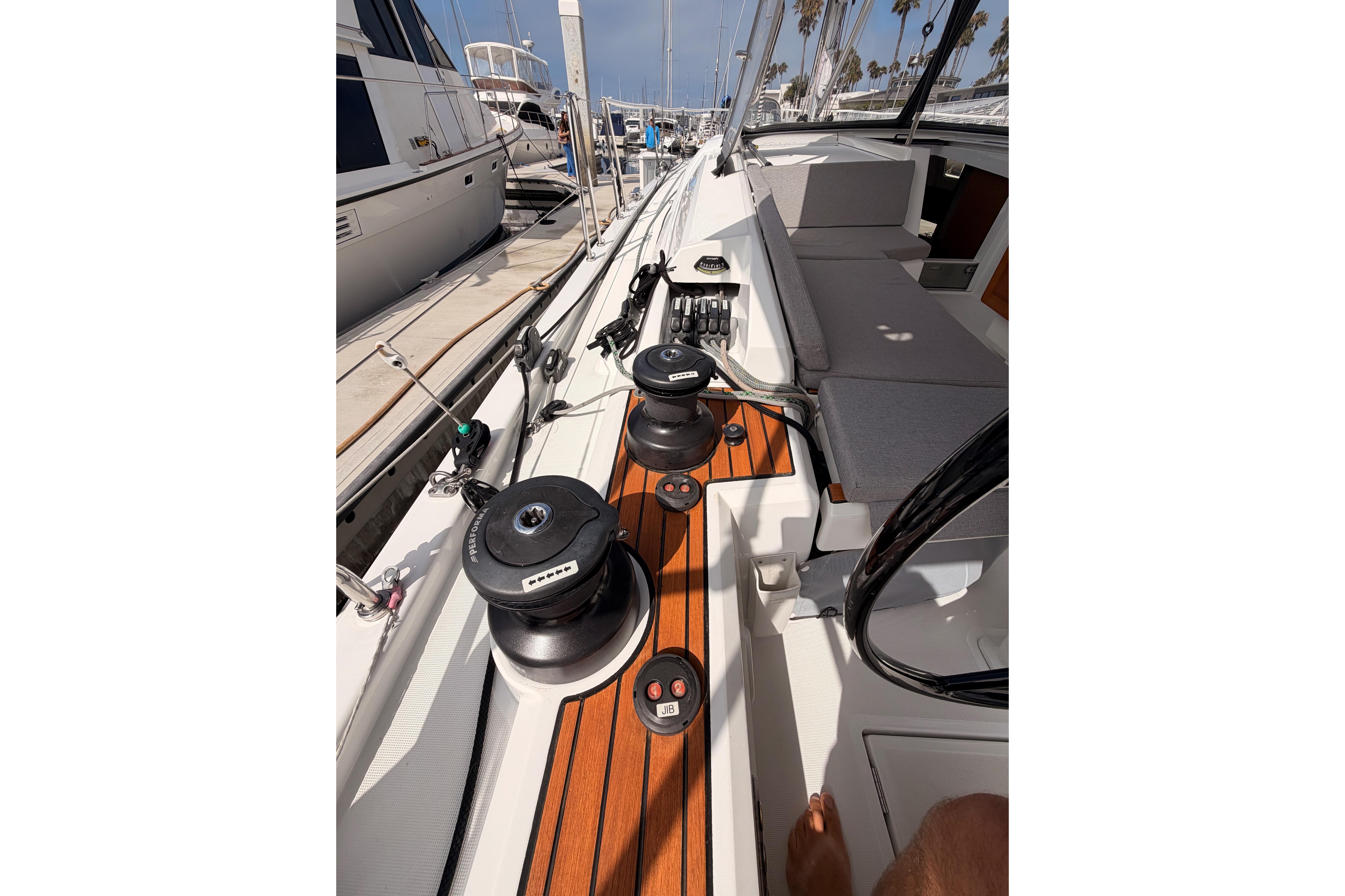 Cockpit view of 2020 Beneteau Oceanis 46.1 sailboat, featuring winches and seating.