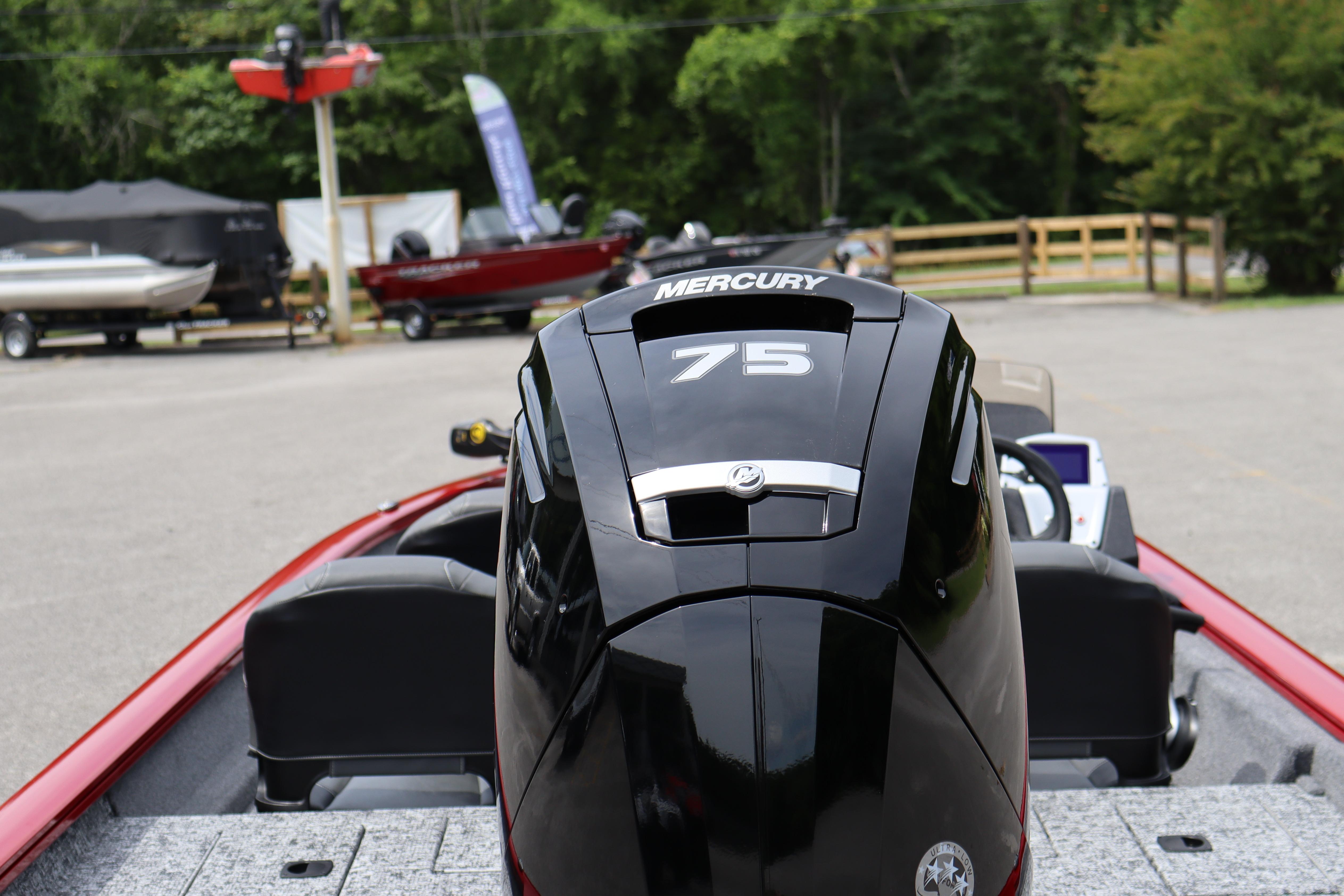 2026 Tracker Pro Team 175 Crappie Edition boat with Mercury 75 engine in a parking area.