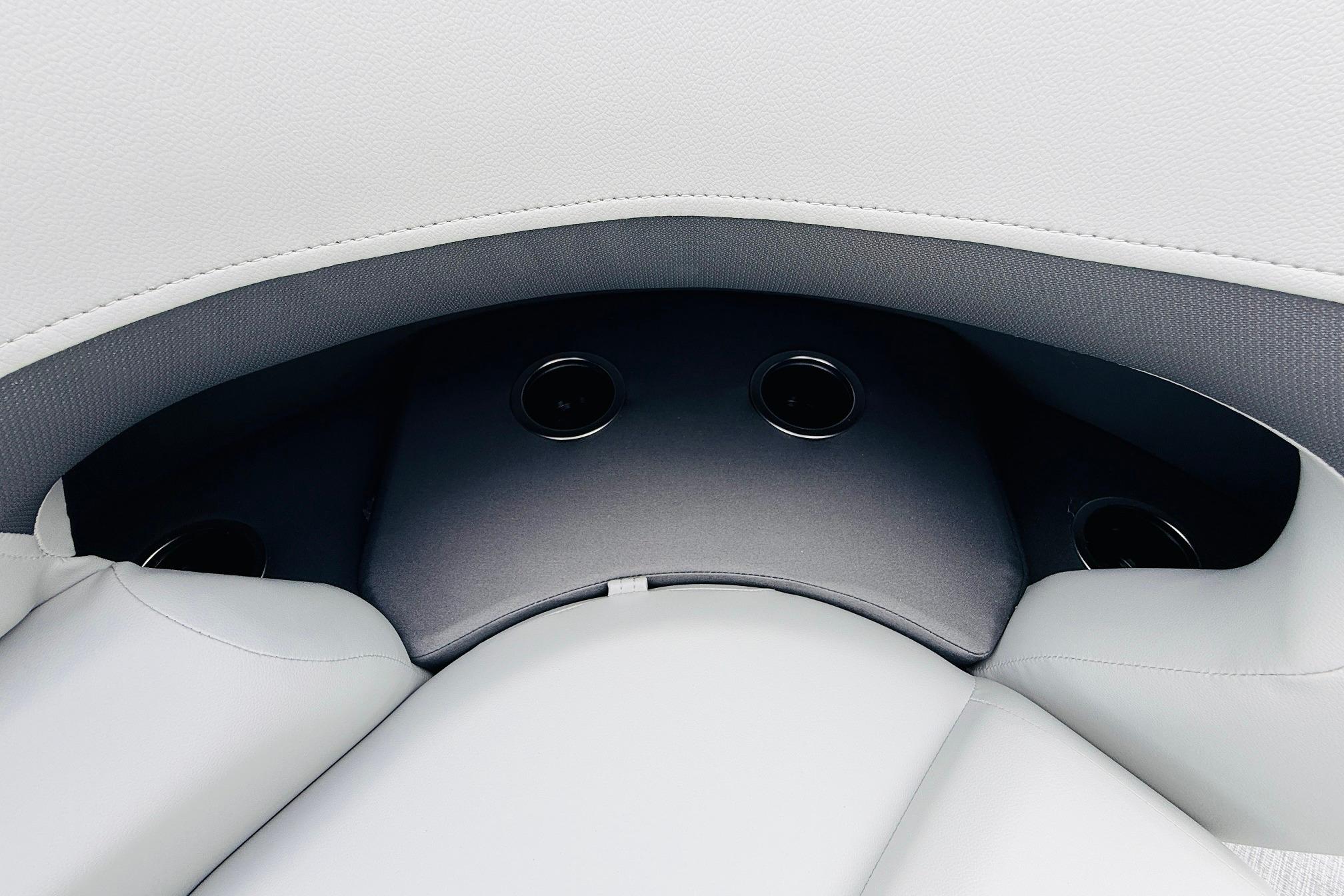 Interior seating of 2026 Sun Tracker SportFish 22 DLX with cup holders.