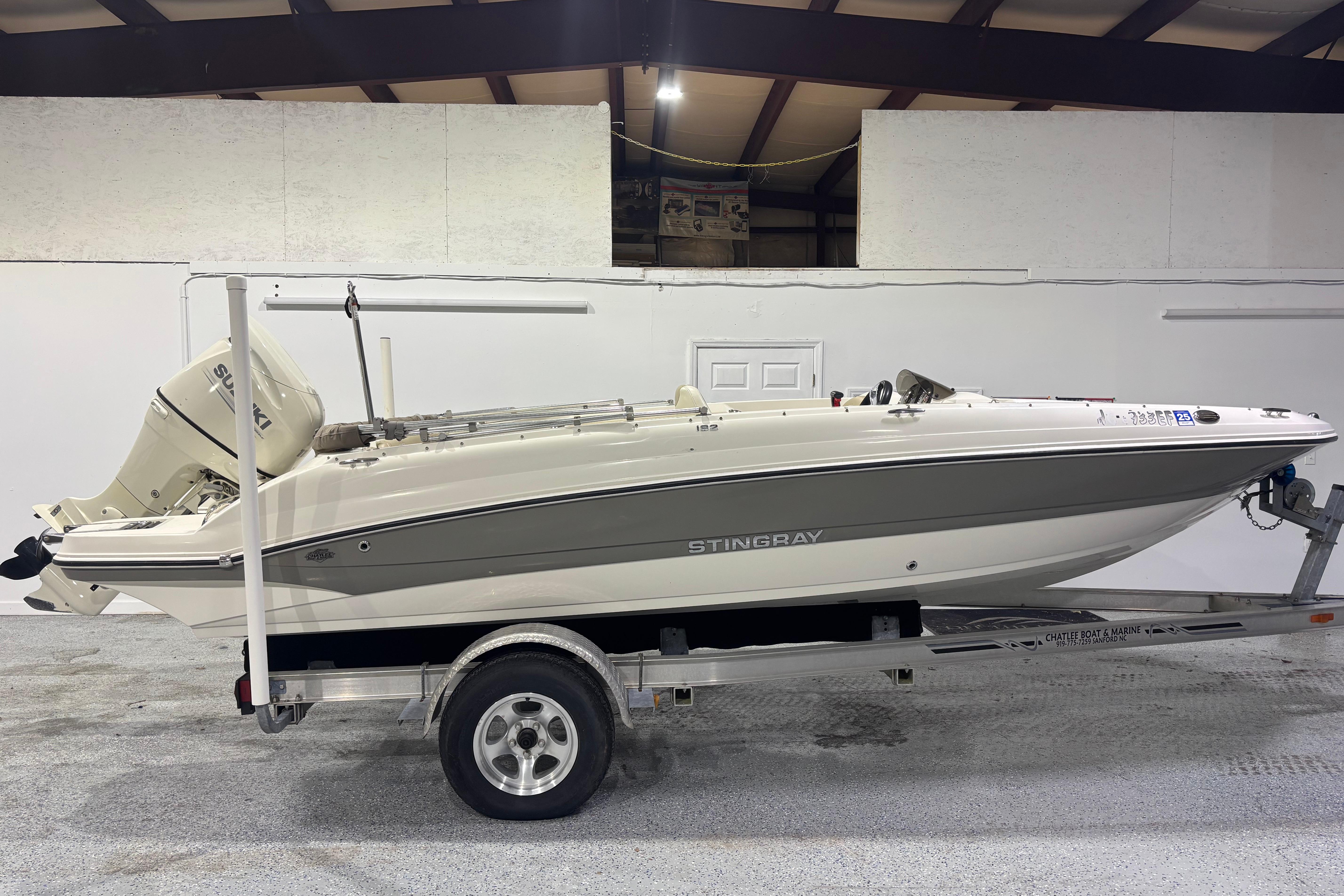 2017 Stingray 182 SC boat on trailer in indoor storage facility.