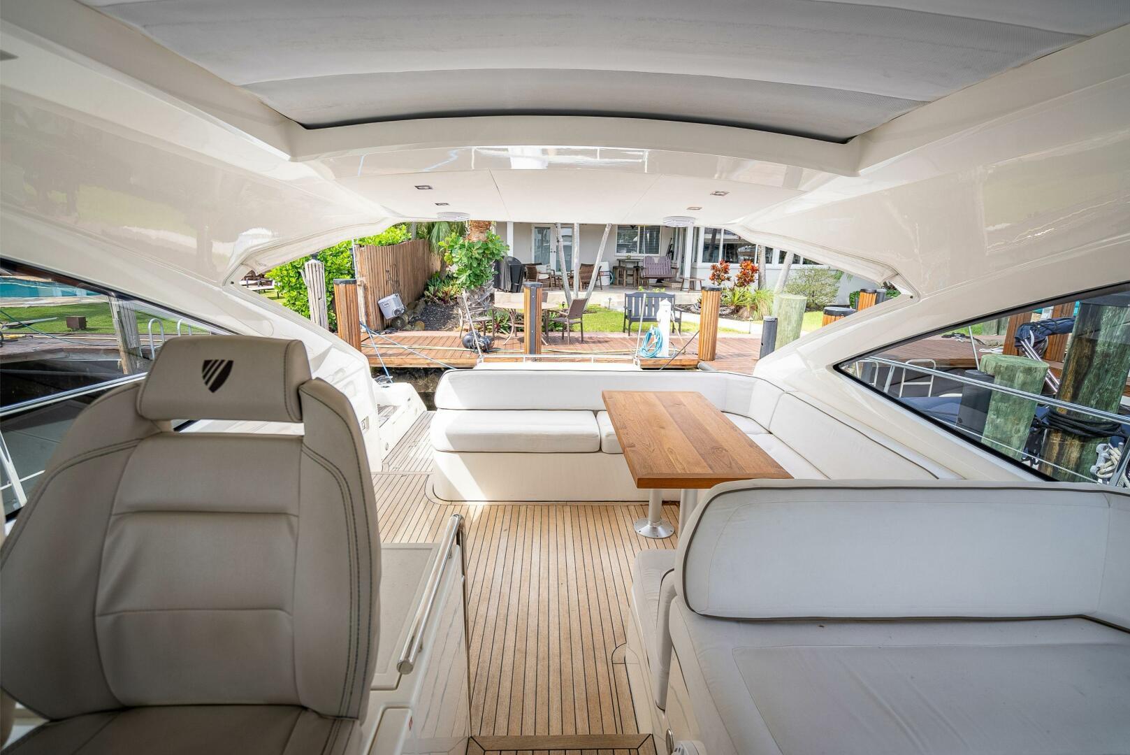 Interior of 2015 Fairline Targa 48 Open yacht with elegant seating and wooden table.