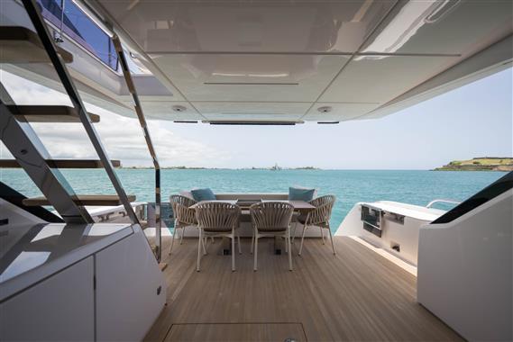 Luxurious 2023 Ferretti Yachts 720 deck with ocean view and elegant seating area.