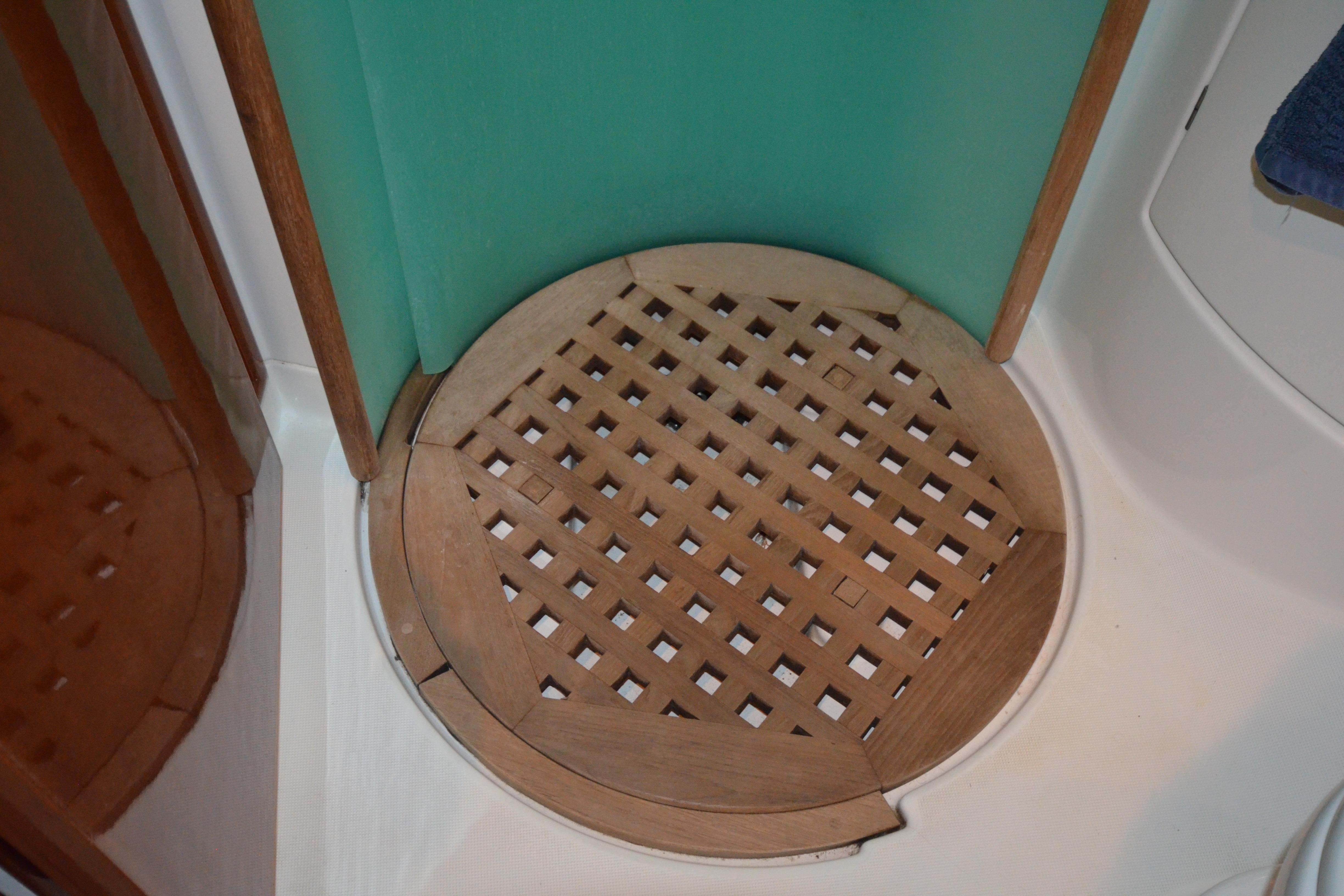 Wooden shower floor in 2007 Jeanneau Prestige 46 yacht bathroom.