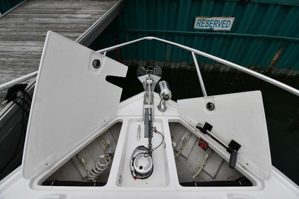 2021 Regal 35 Sport Coupe boat anchor compartment at dock with reserved sign.
