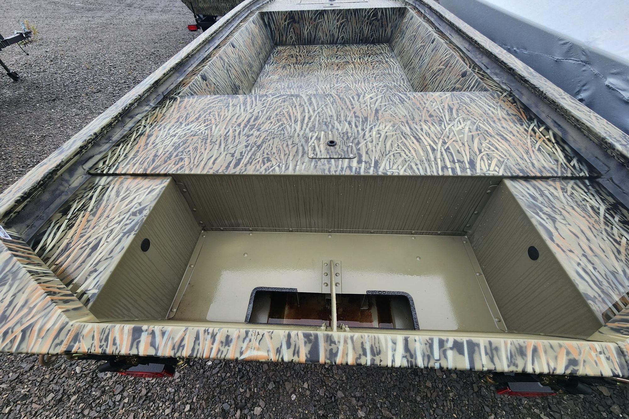2026 Tracker Grizzly 1648 Utility boat with camouflage interior design.
