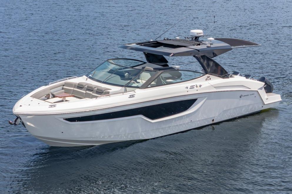 2021 Cruisers Yachts 38 GLS on calm water, showcasing sleek design and luxury features.