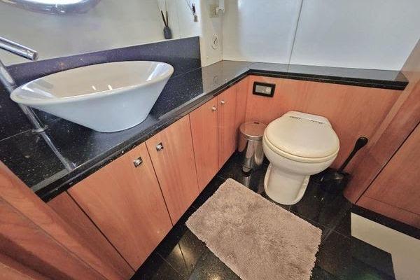 Luxurious bathroom in 2005 Sunseeker Manhattan 66 yacht with modern sink and toilet.