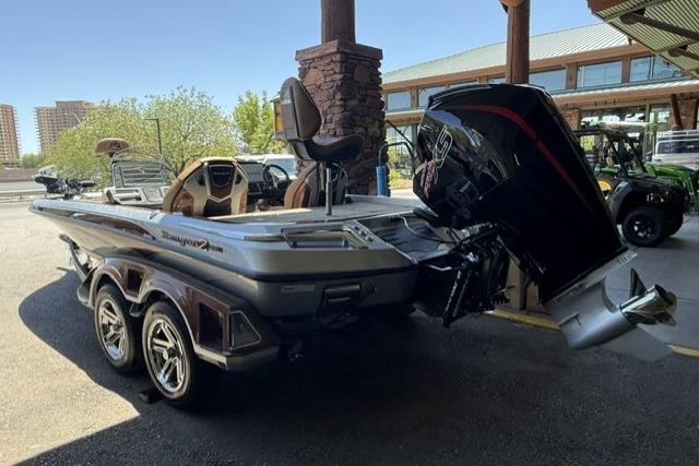 2026 Ranger Z521R Cup-Equipped boat with powerful outboard motor in a showroom setting.