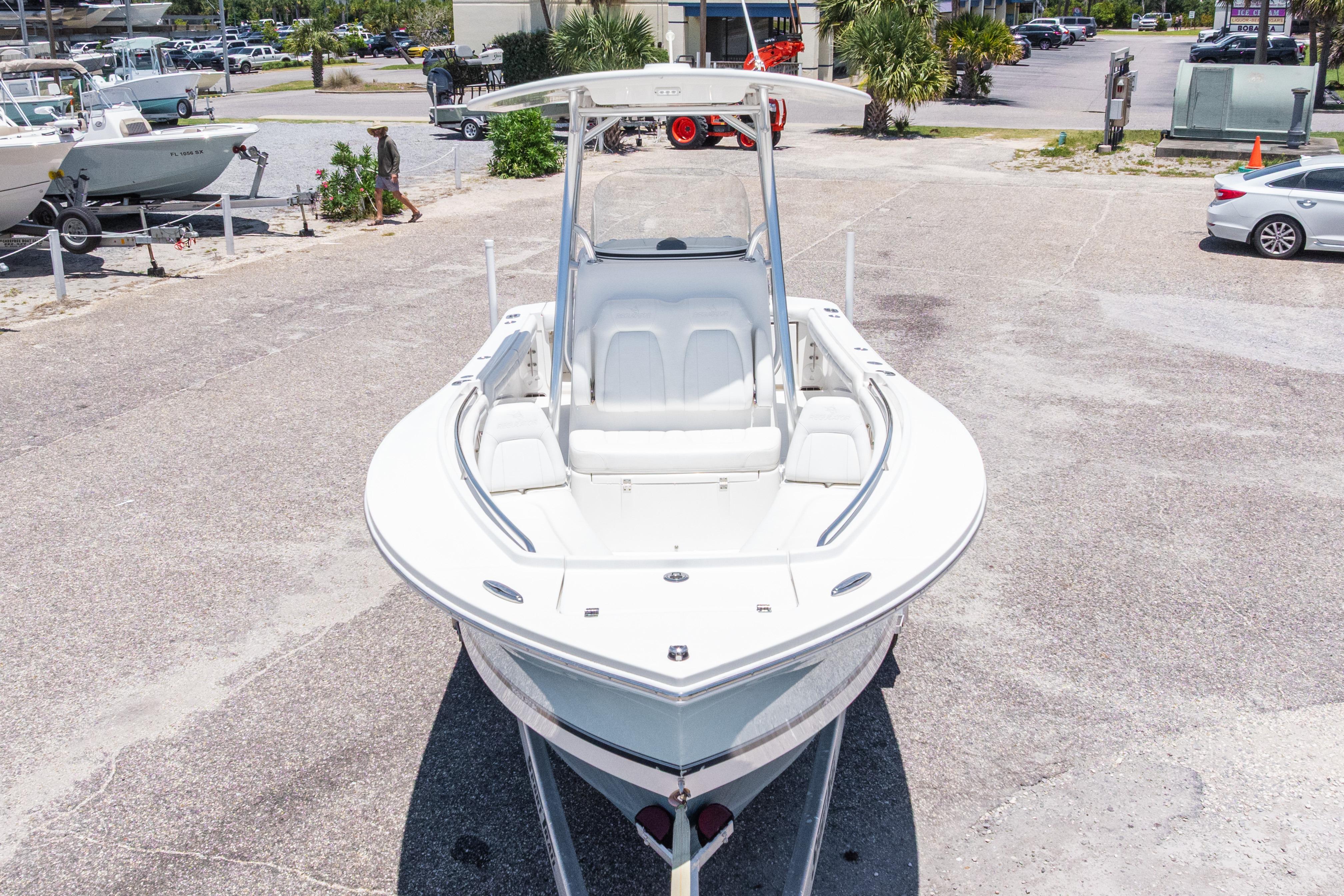 2019 Regulator 23 Center Console boat in a parking lot, front view.