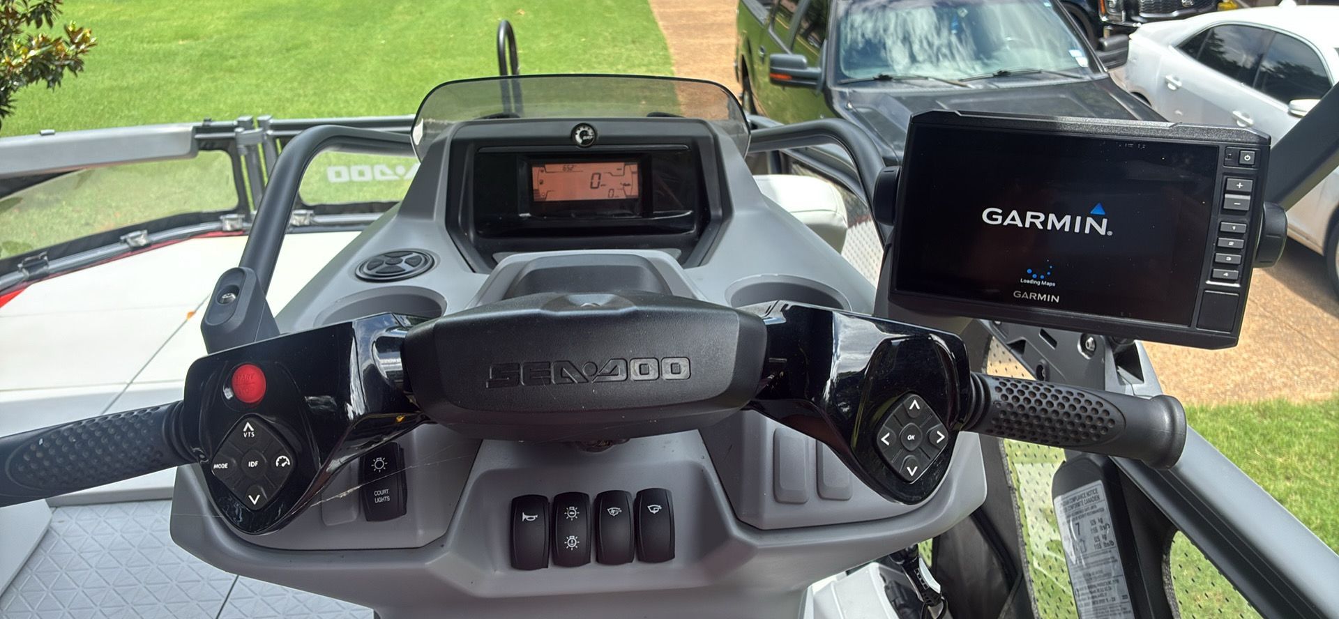 Dashboard of a Sea-Doo Switch Sport 18 with Garmin navigation system and controls.