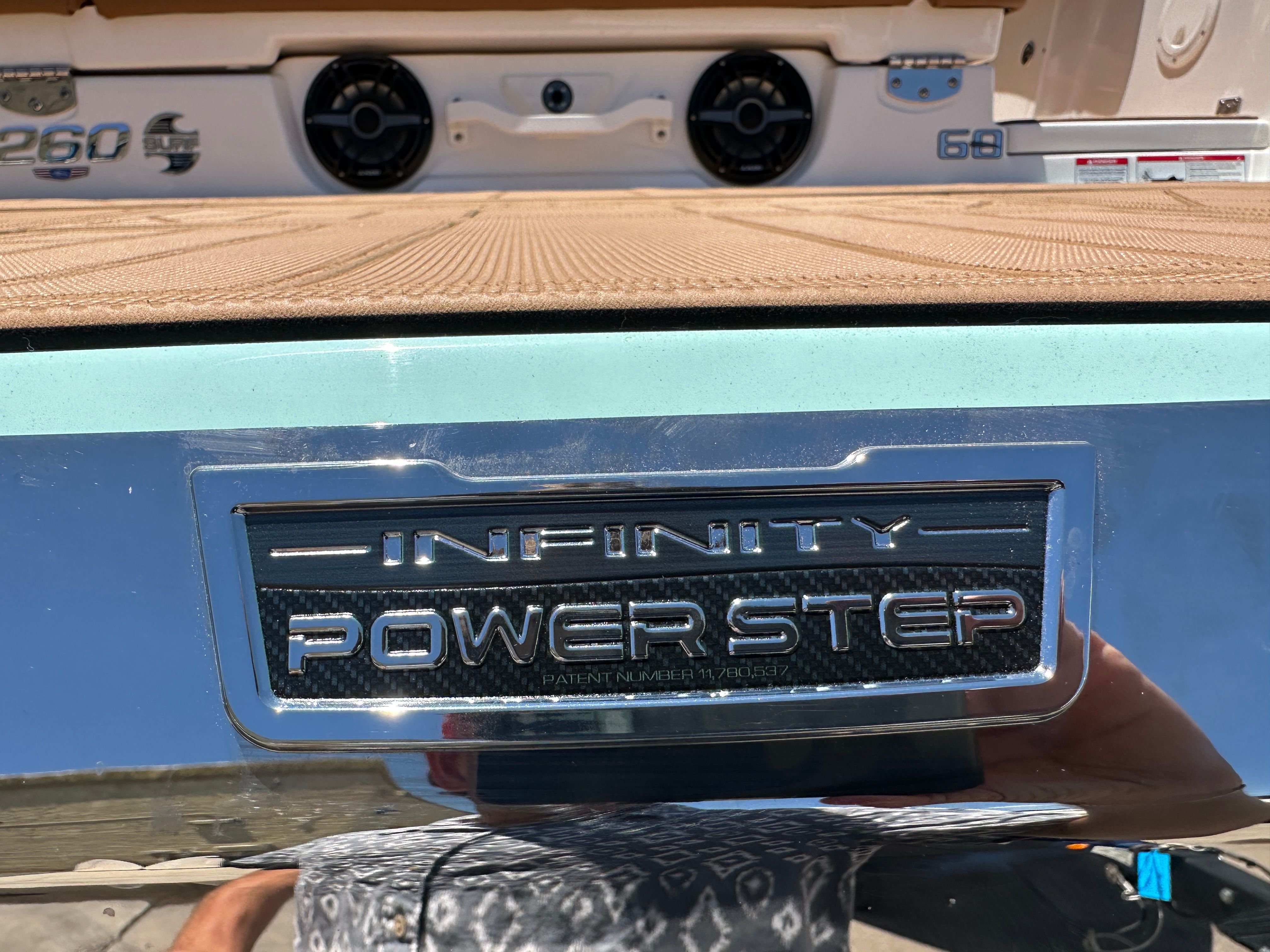 Close-up of an Infinity Power Step platform on a Chaparral 26 Surf boat.