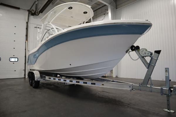 2025 Sea Fox 228 Traveler boat on trailer in indoor storage facility.