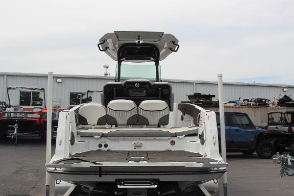 2023 Scarab 255 Open ID boat, rear view, in a parking lot.