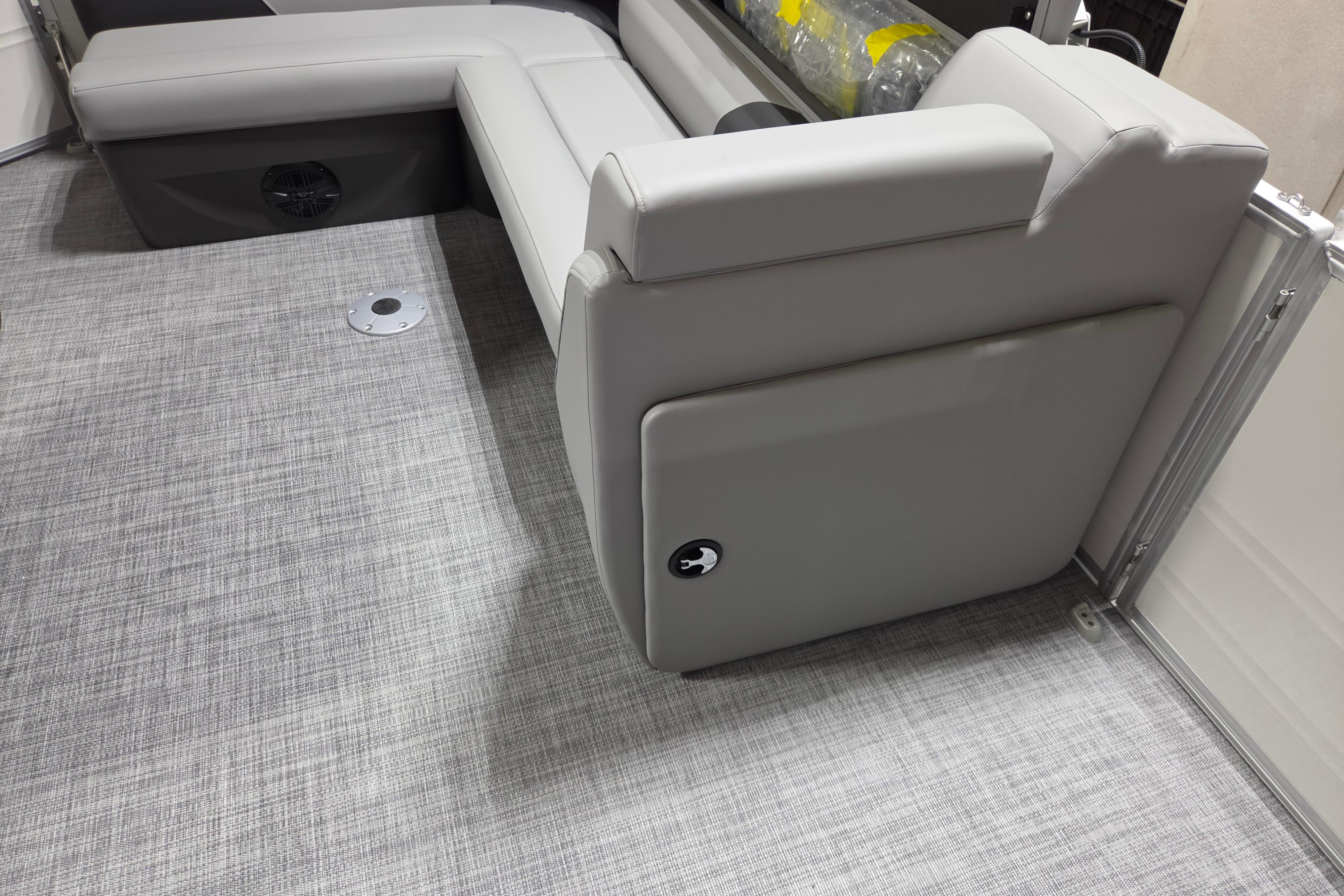 2026 Sun Tracker Party Barge 20 DLX interior with gray seating and flooring.