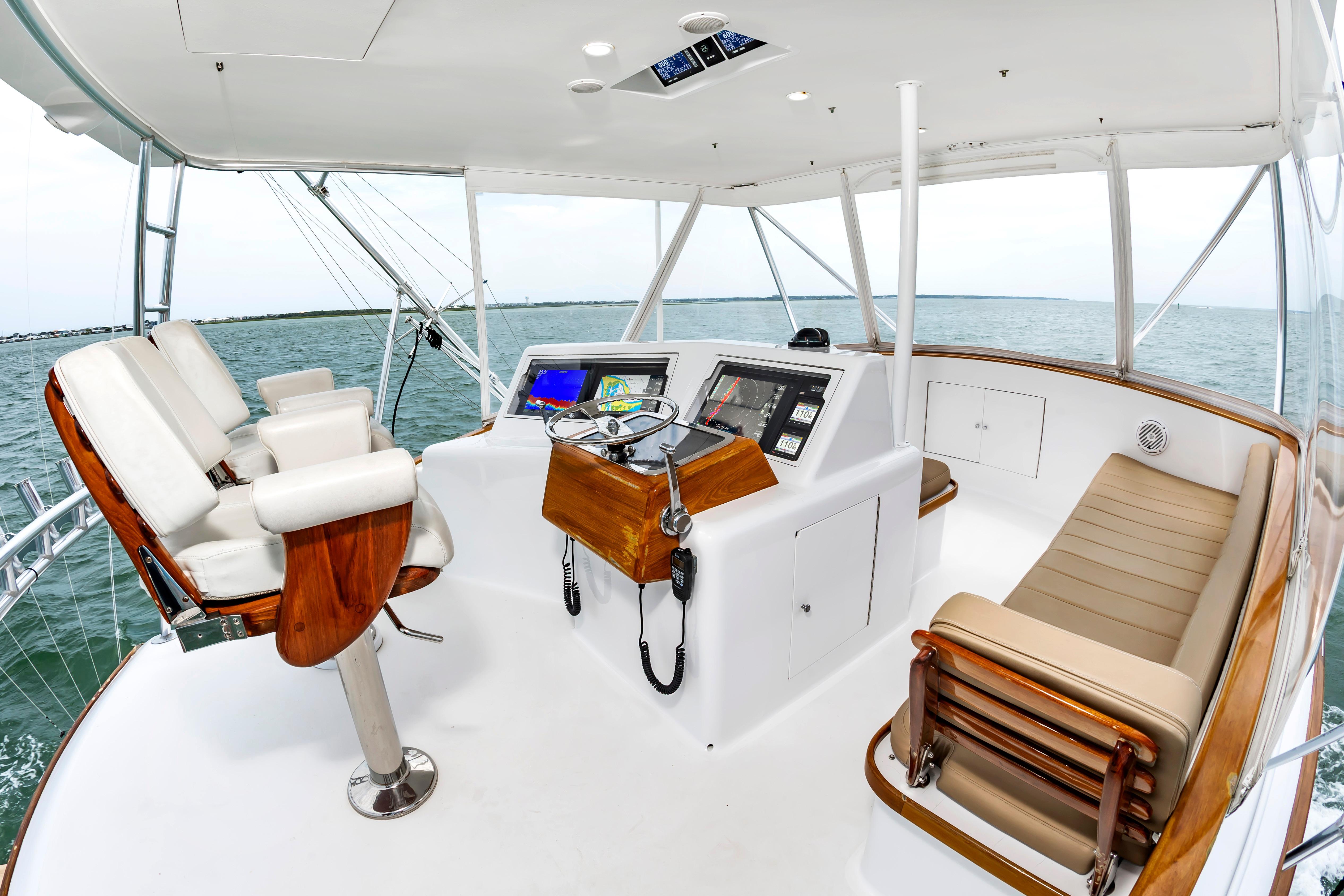 Helm of 1993 Custom Carolina Scarborough 56 Convertible yacht with ocean view.