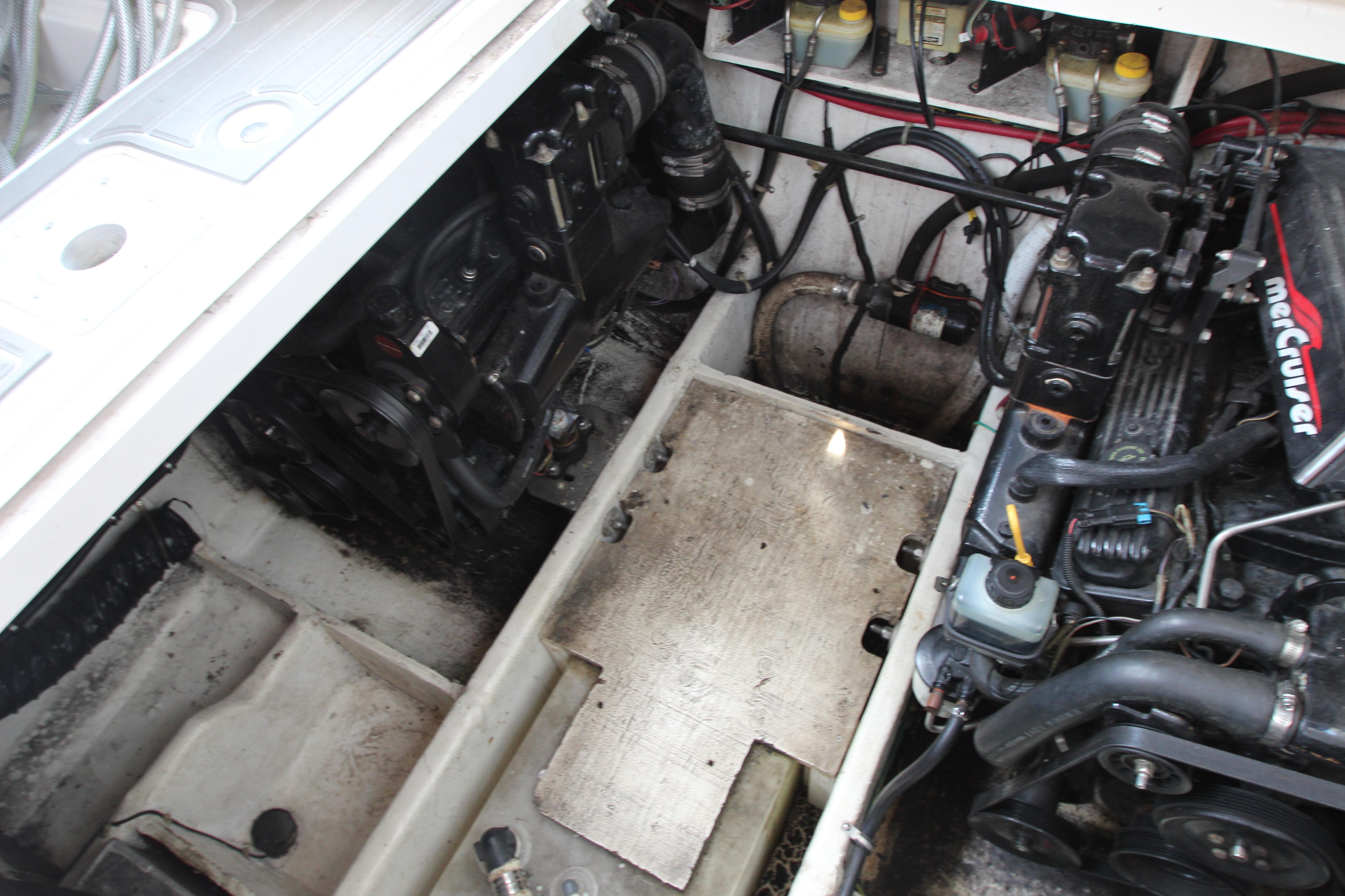 Engine compartment of a 1999 Bayliner 3055 Ciera boat, featuring MerCruiser components.