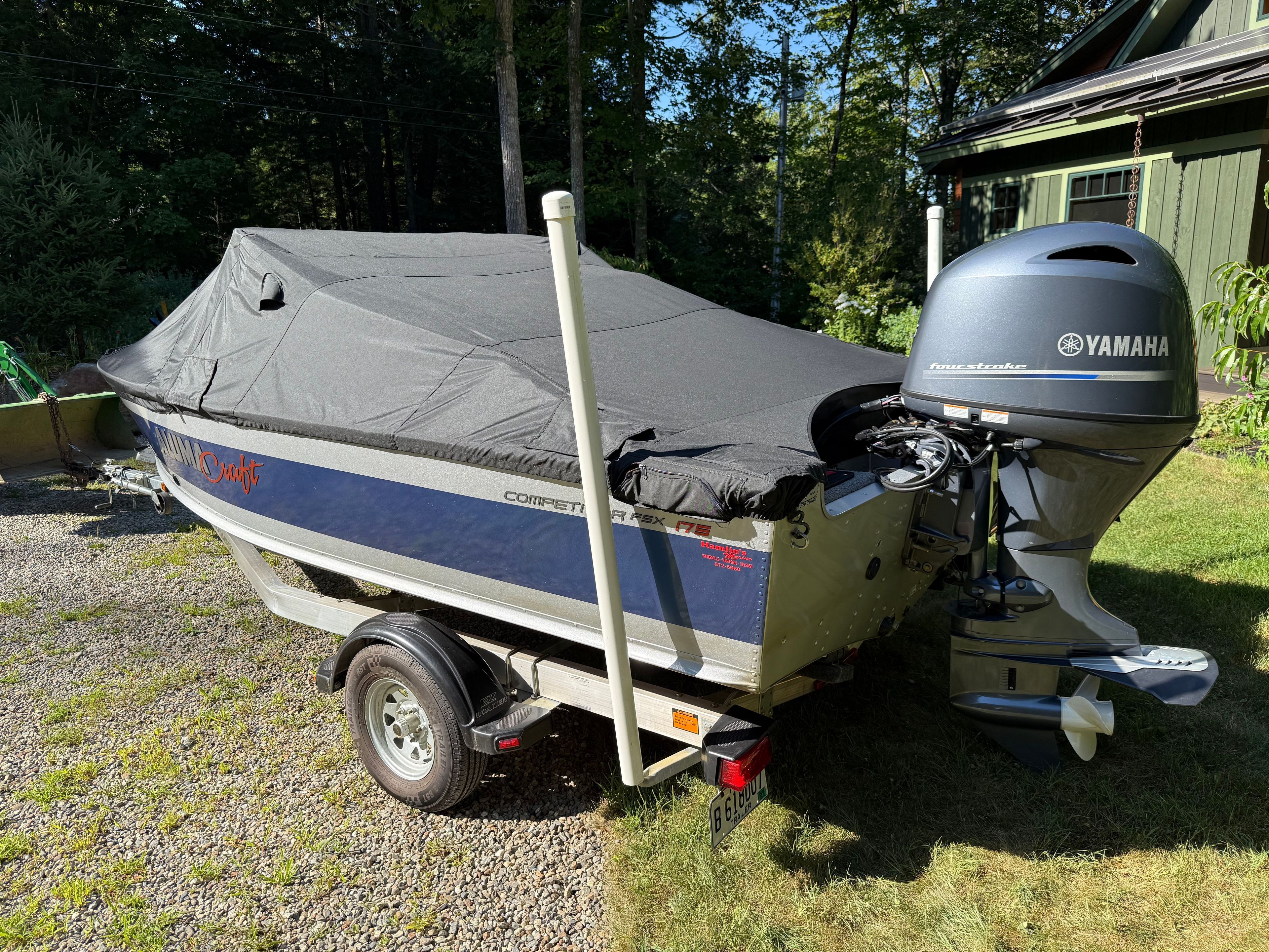 2022 Alumacraft Competitor 175 Sport with Yamaha outboard motor, parked on a trailer.