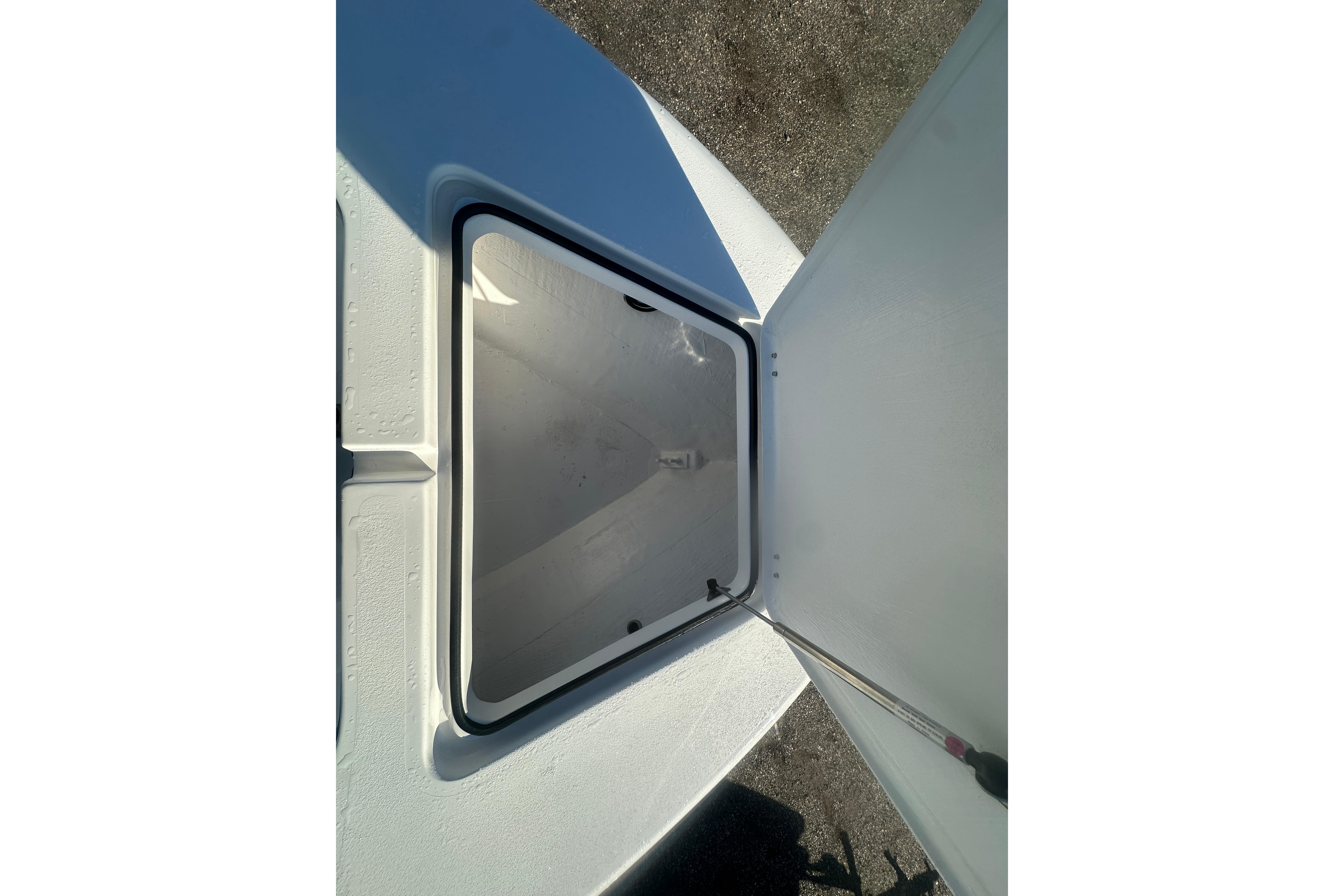 Open storage compartment on 2026 Delta Boatworks Delta D245 boat.