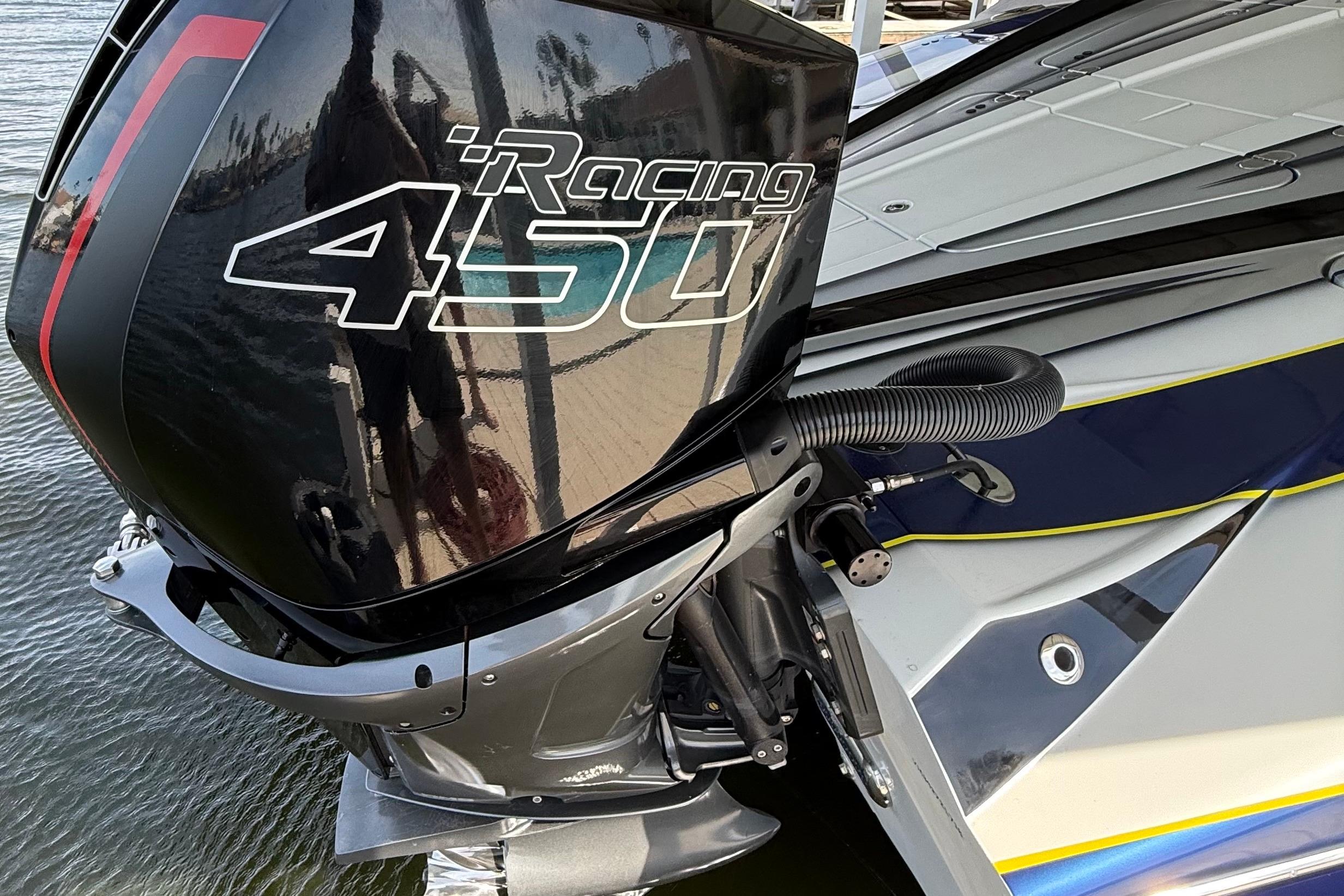 High-performance MTI 340X boat with Racing 450 engine, 2018 model, docked by water.