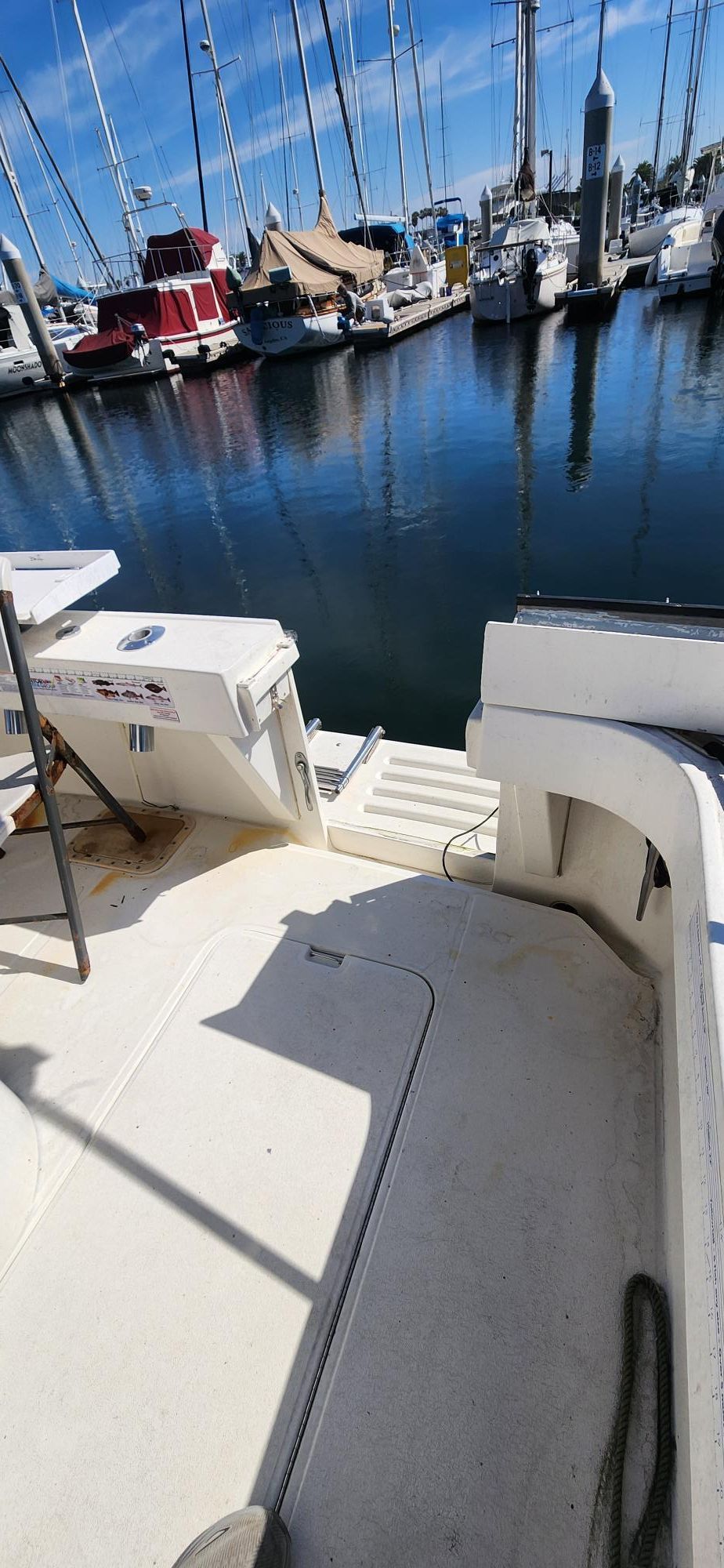 1990 Luhrs 320 boat docked at marina.