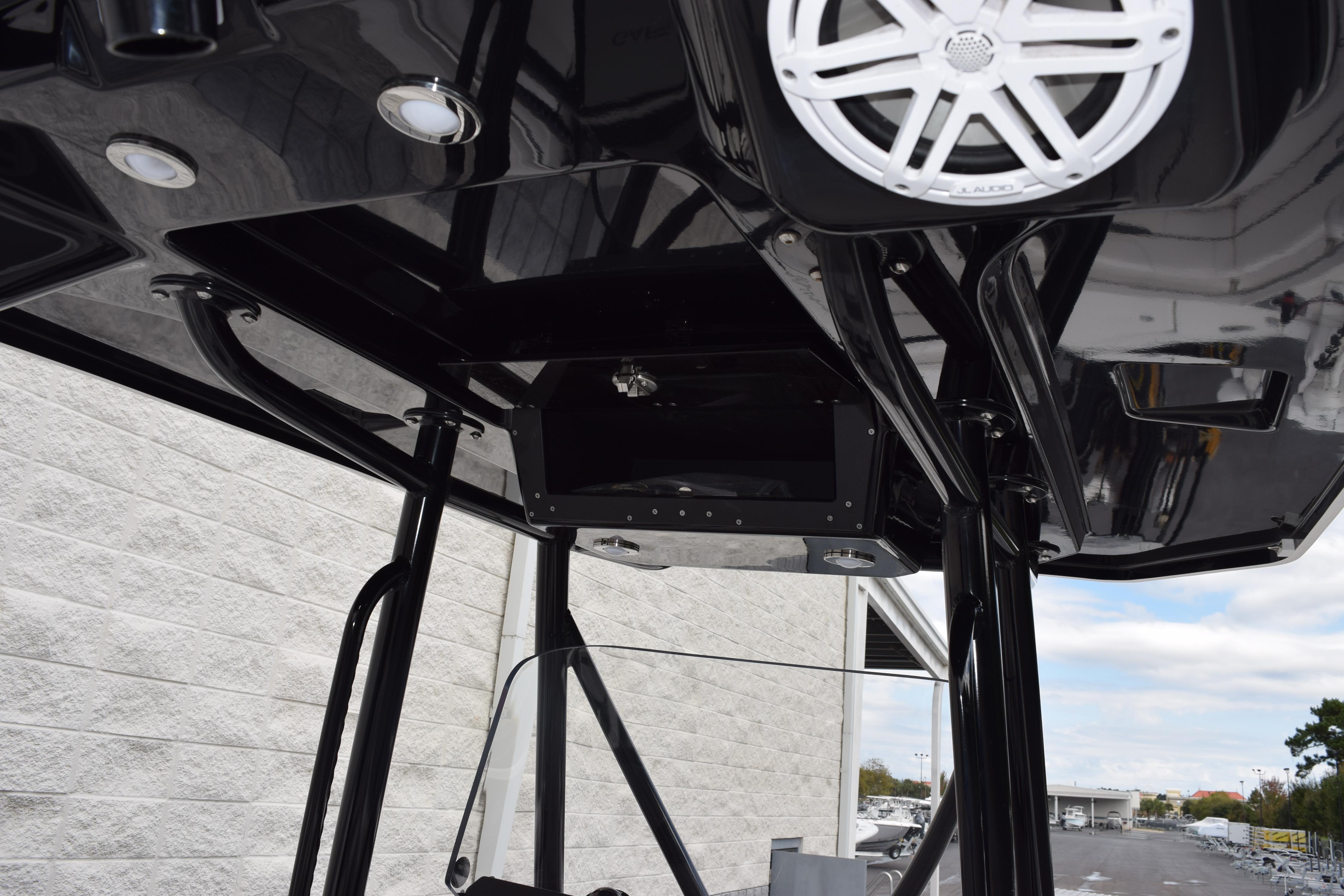 2023 Blackfin 252 CC boat interior with sleek black design and modern speaker system.