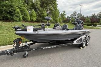 2026 Ranger Z519R Cup-Equipped boat on trailer, parked on roadside with lush greenery.