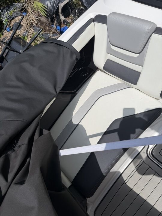 Interior of a Yamaha 212SD boat with gray and black seating.