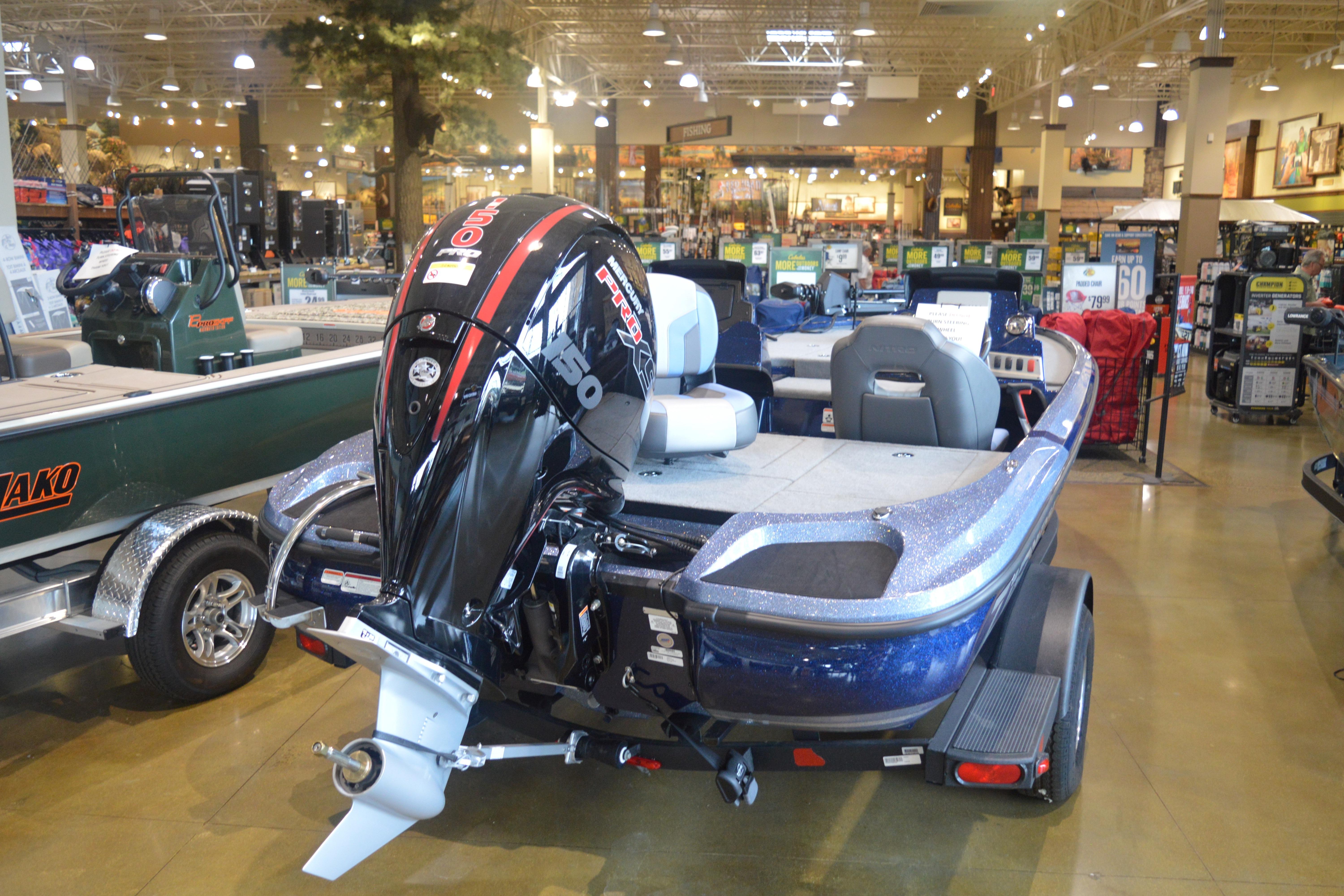 2026 Nitro Z18 Pro boat with powerful outboard motor displayed in a showroom.