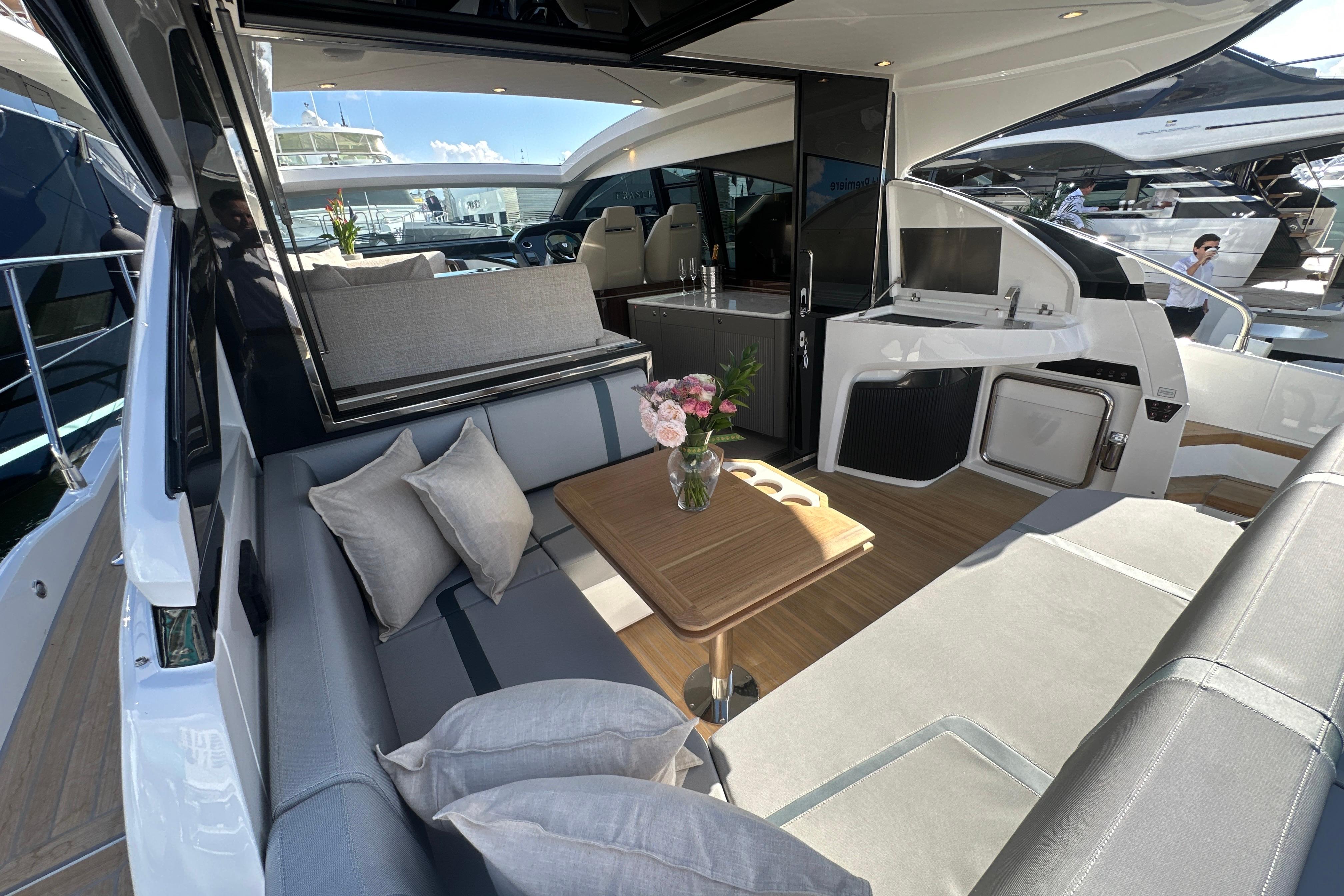 Luxurious interior of 2026 Fairline Targa 47 GT yacht with elegant seating and table.