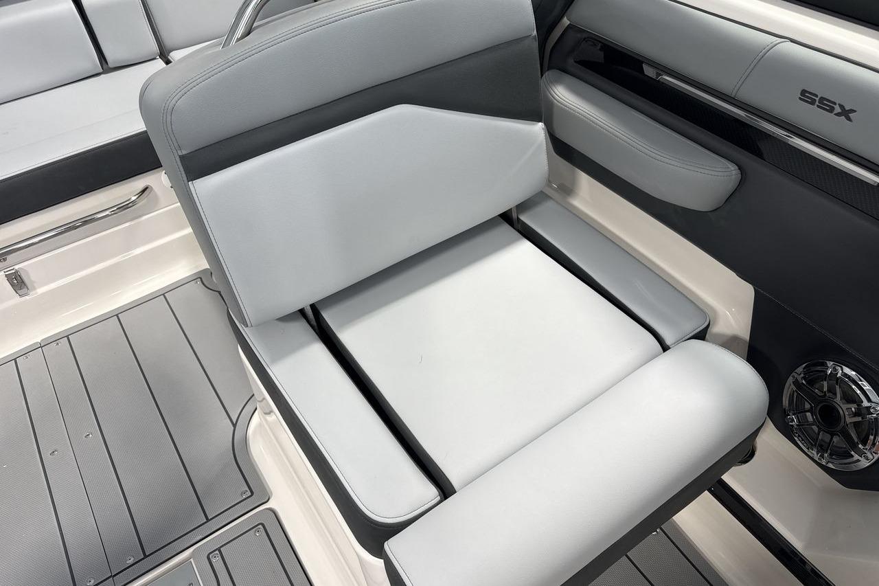 Interior of a 2026 Chaparral SSX 4 with gray upholstery and modern details.
