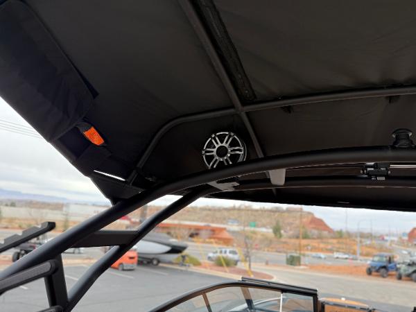 2025 Yamaha Boats 255XD interior view with speaker and canopy details.
