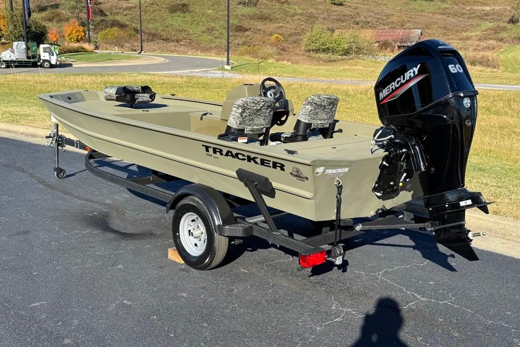 2026 Tracker Grizzly 1754 SC boat with Mercury 60 engine on trailer, outdoor setting.