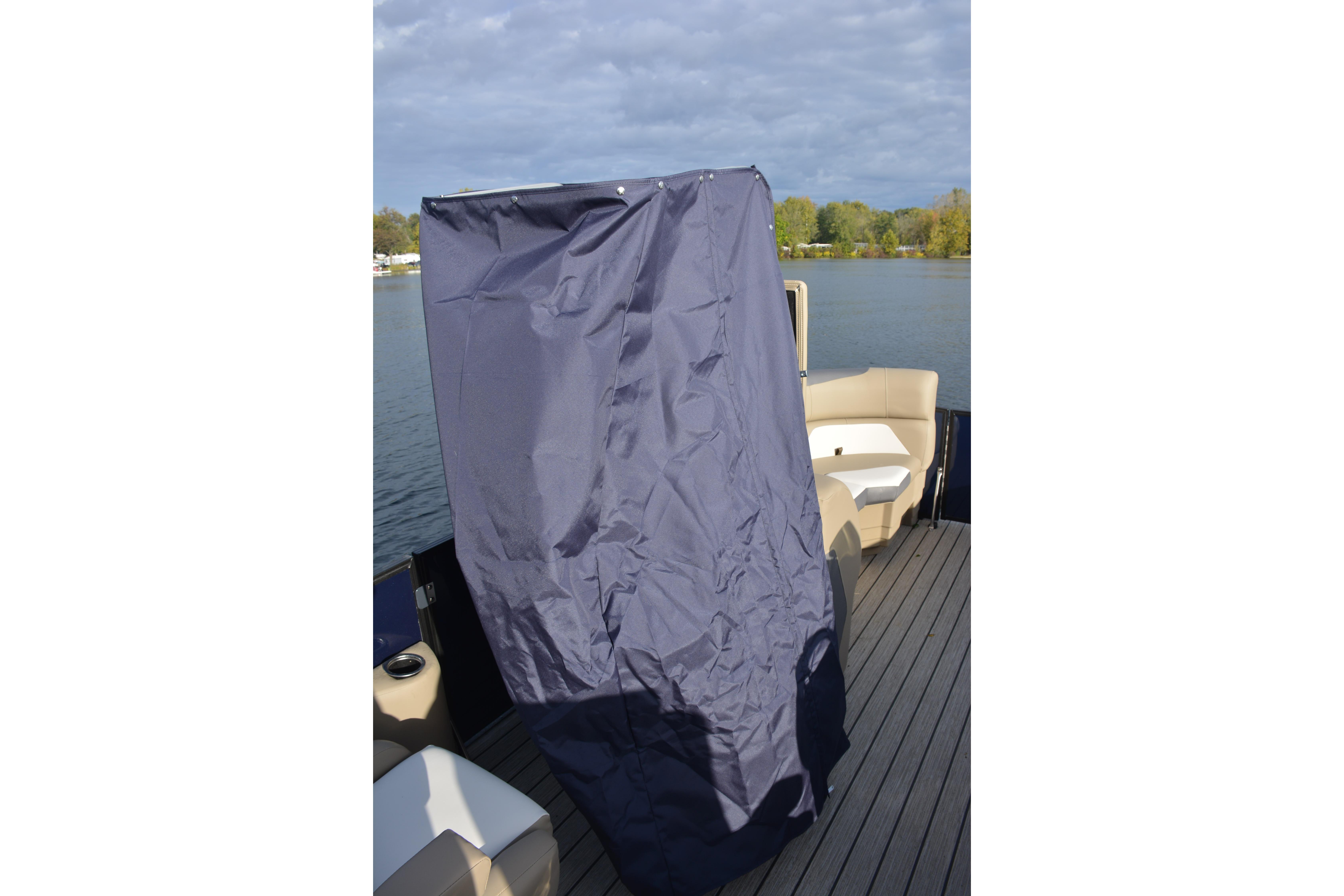 SunChaser Eclipse 25 LR DH 2026 boat with privacy curtain on deck, lake view.