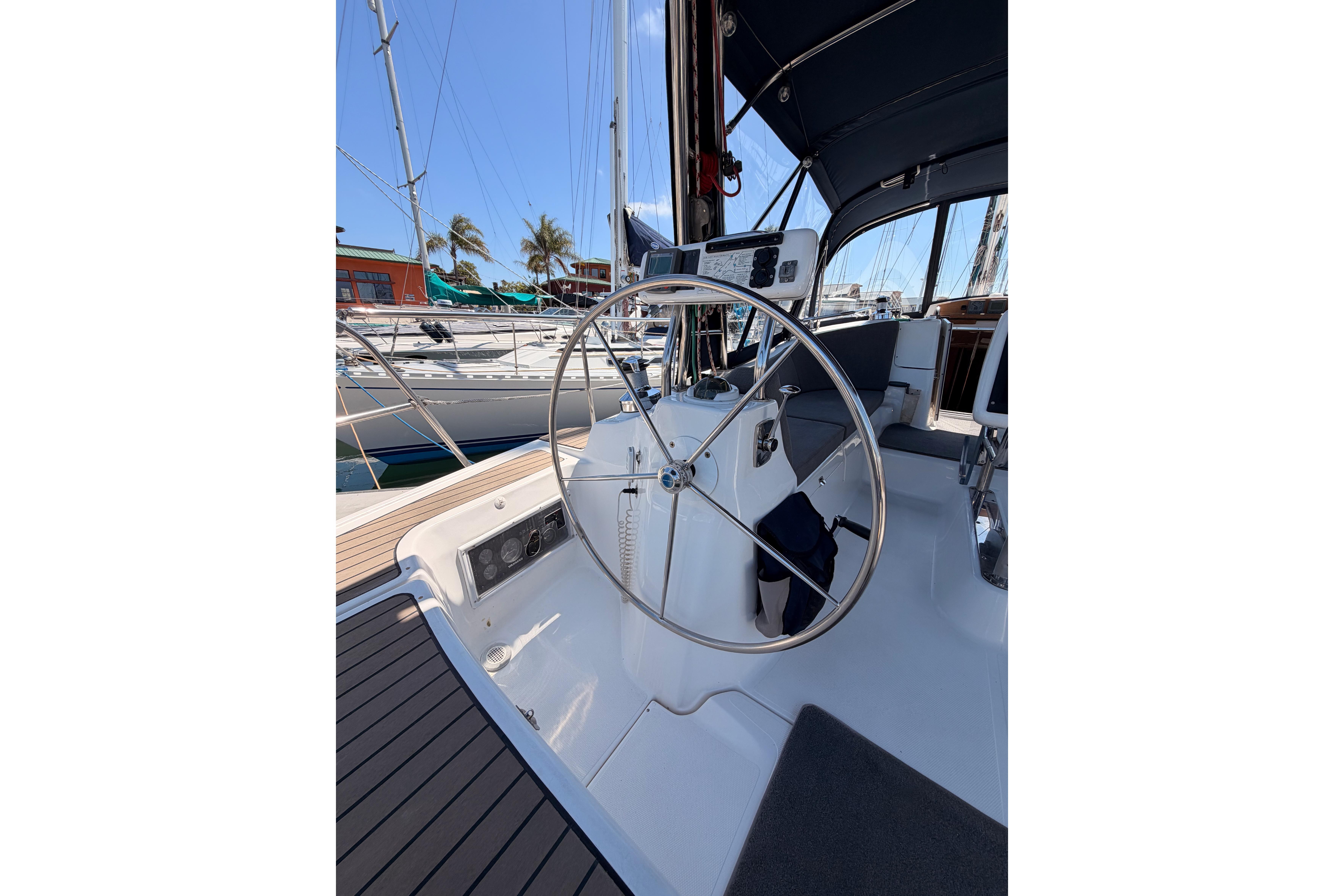 2008 Hunter 45 Deck Salon sailboat cockpit with steering wheel and navigation instruments.