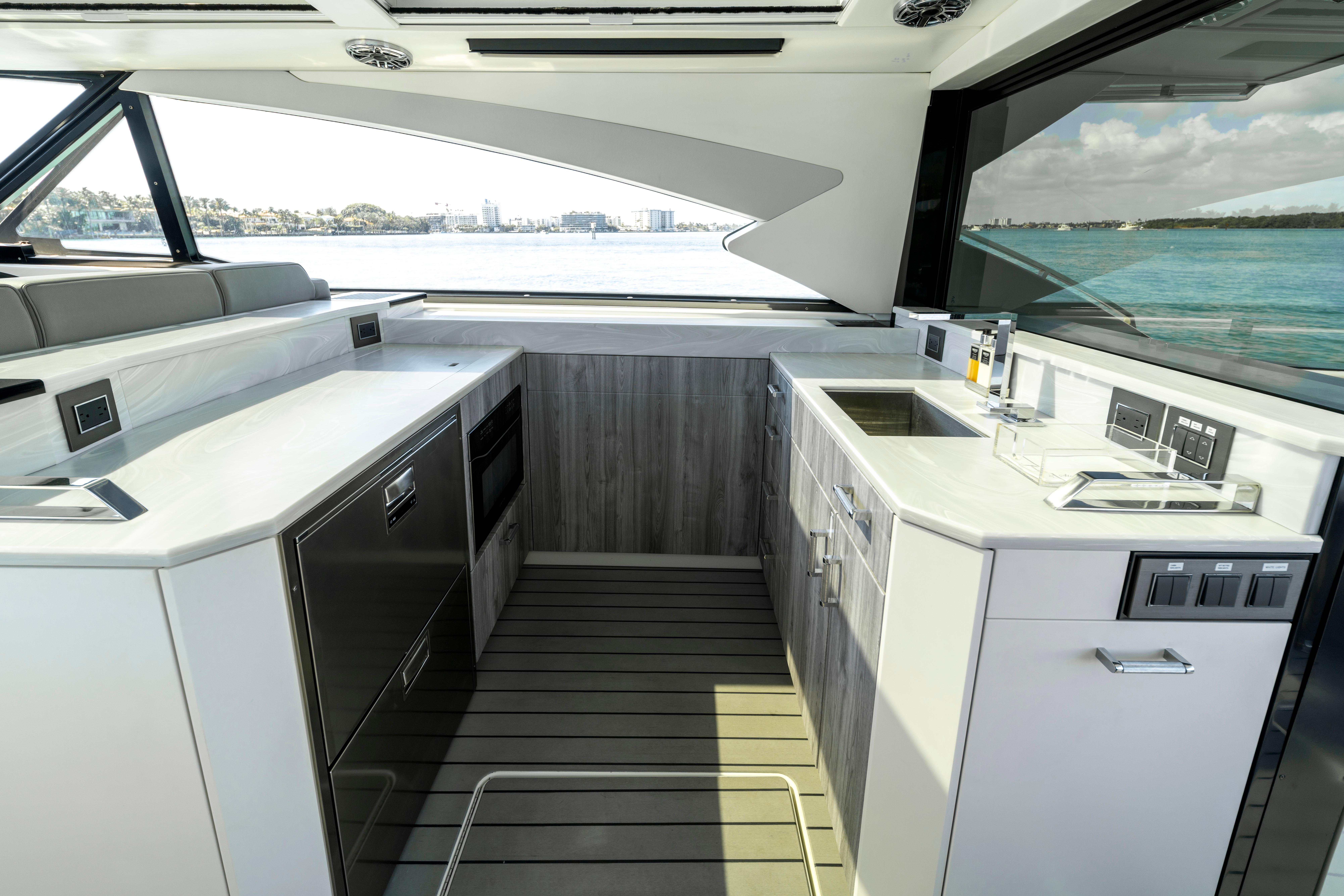 Luxurious interior of 2022 Formula 500 Super Sport Crossover yacht with modern kitchen amenities.