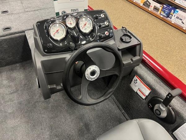 2025 Tracker Pro 170 boat dashboard with steering wheel and gauges.