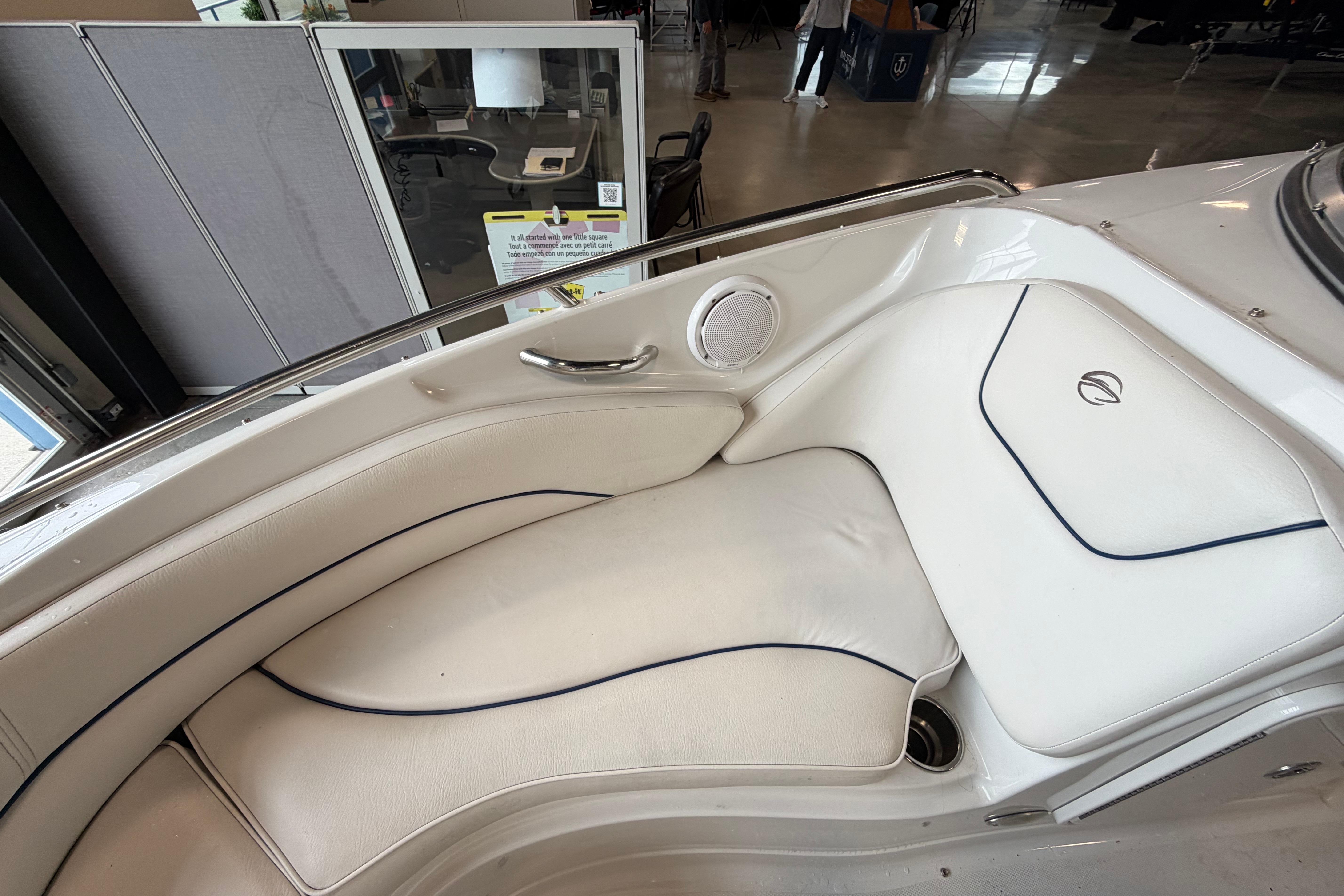 2008 Crownline 220 LS boat interior with white cushioned seating and speaker.