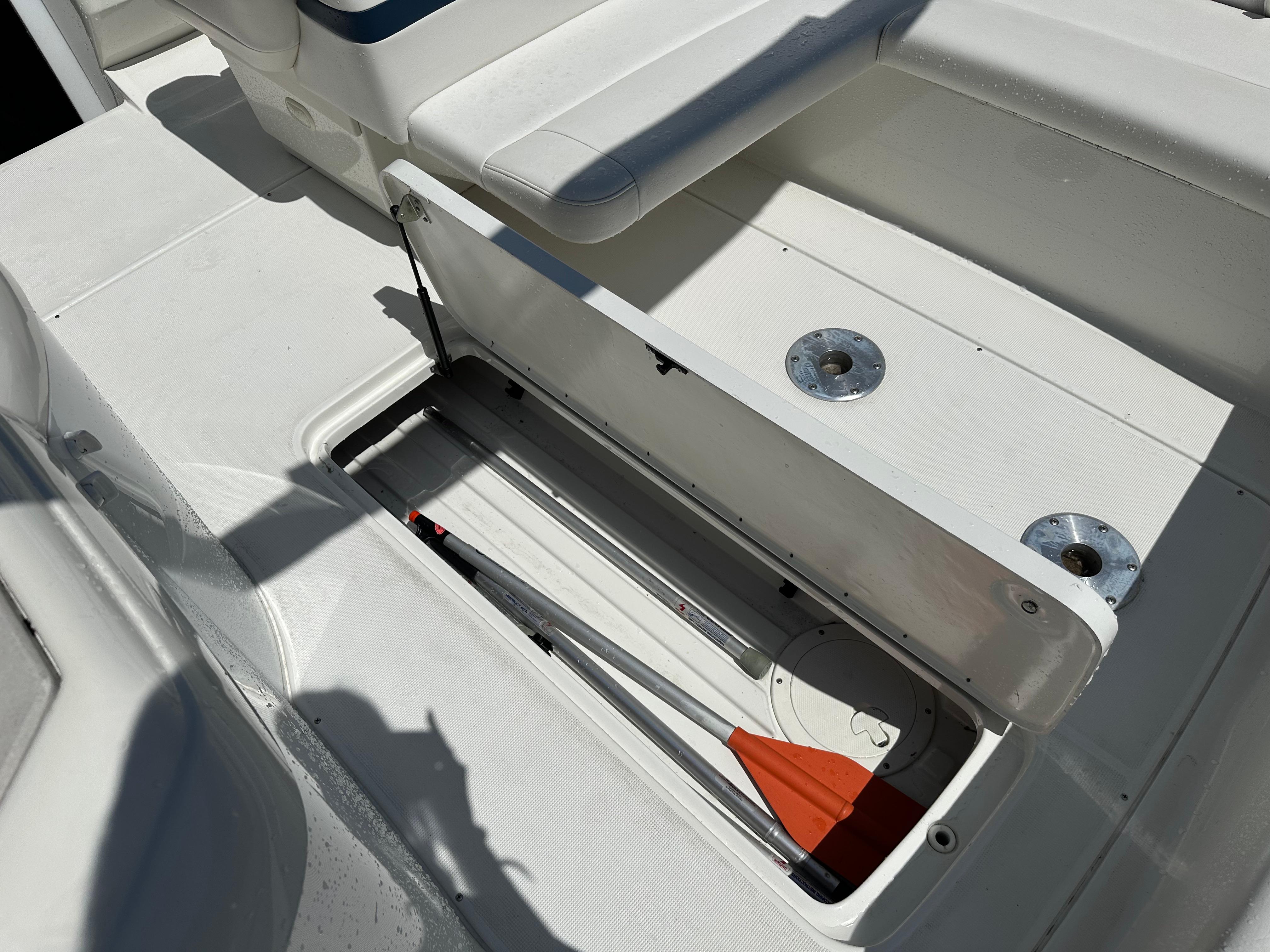 Open storage compartment on a 2000 Formula 330 SS boat deck.