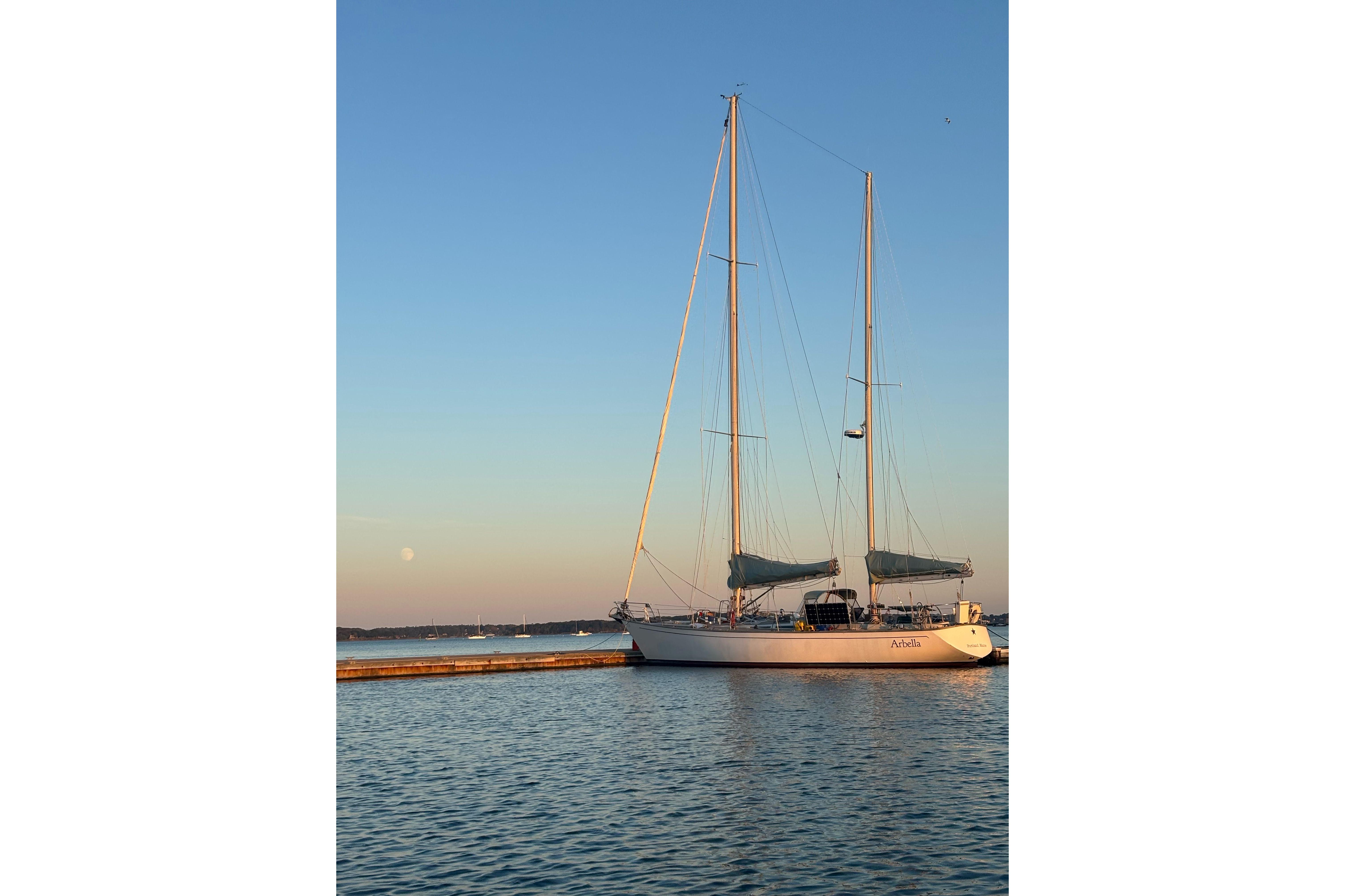 Sailboat SKYE 51 from 1981 docked at sunset with clear sky.