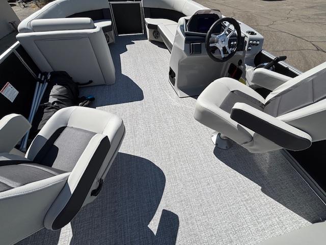 2025 Harris Cruiser 230 boat interior with modern seating and steering console.