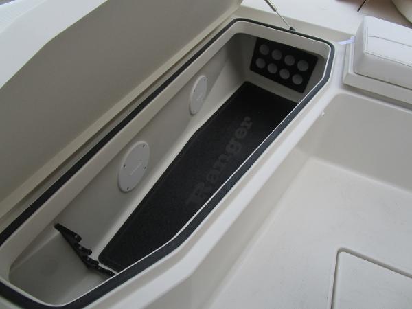 Storage compartment of 2024 Ranger 2360 Bay boat with open lid.