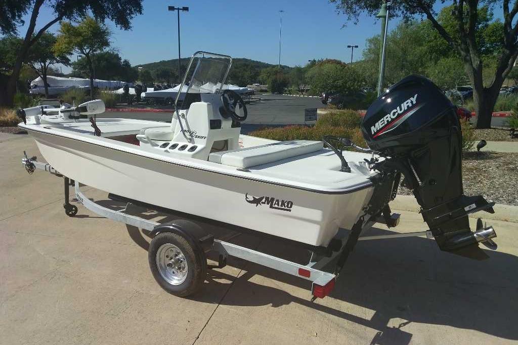 2026 Mako Pro Skiff 13 CC boat on trailer with Mercury outboard motor.