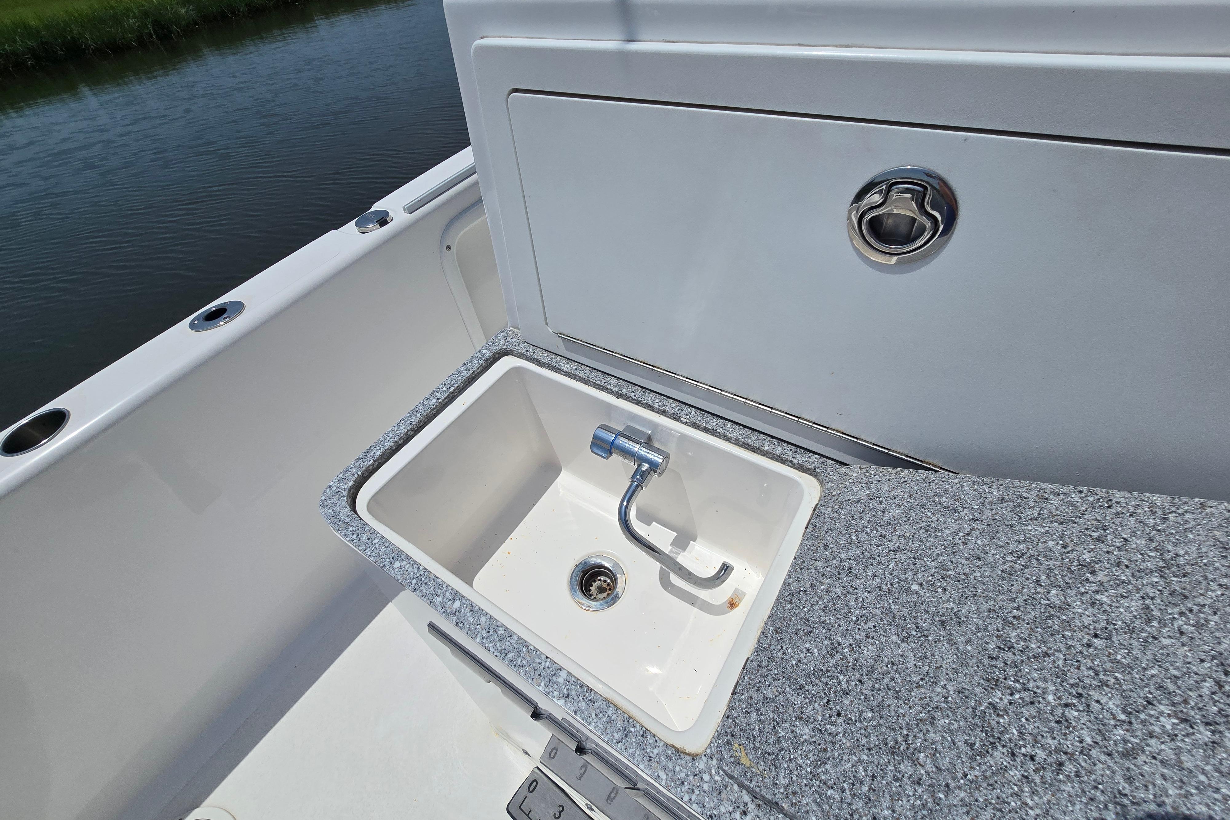 2021 Twin Vee 280 GFX CC boat sink with granite countertop detail.