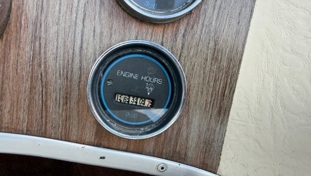 1978 MasterCraft Stars and Stripes engine hour meter on wood panel.