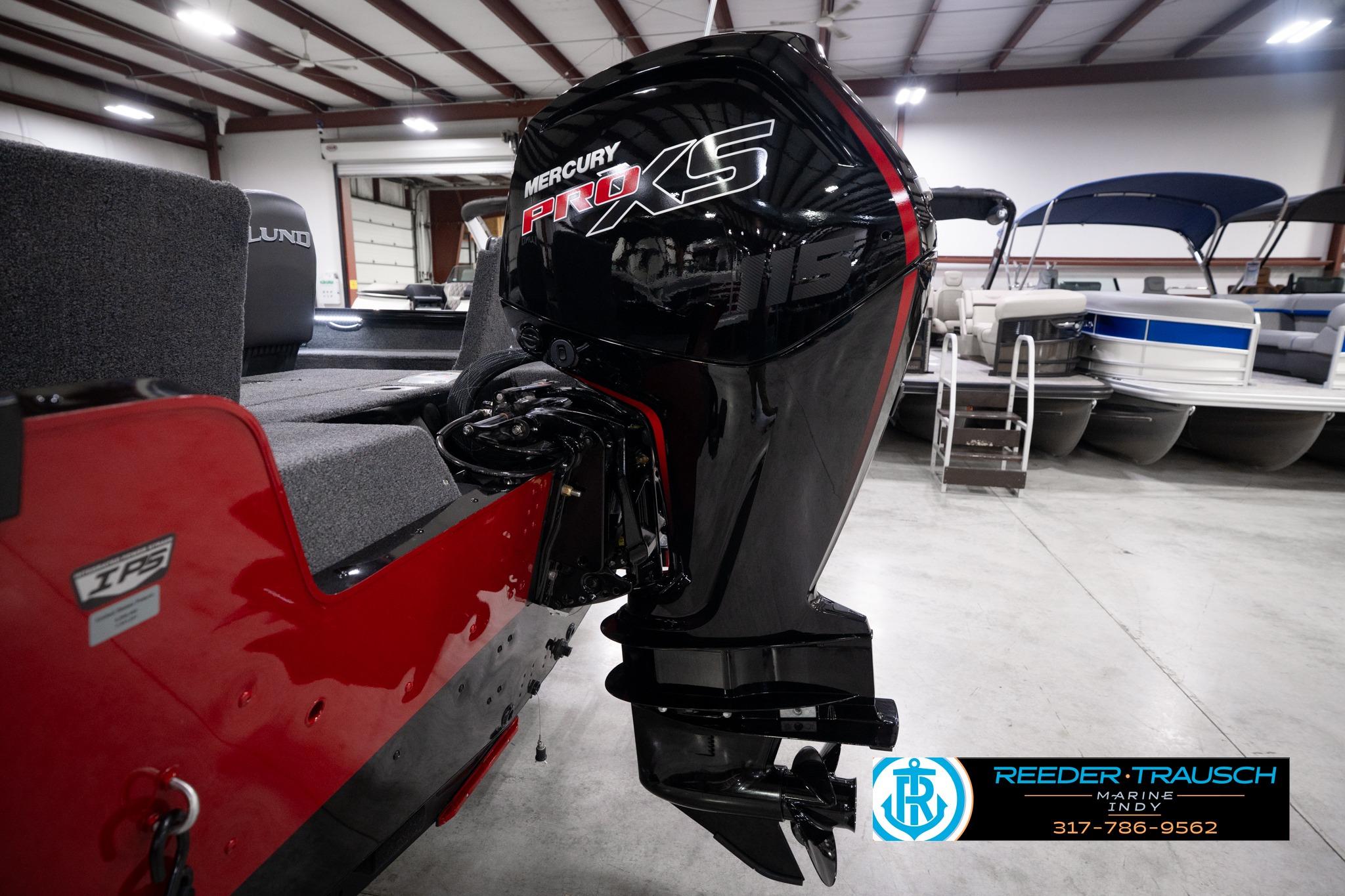 2026 Lund 1775 Impact XS SS boat with Mercury Pro XS engine in showroom.