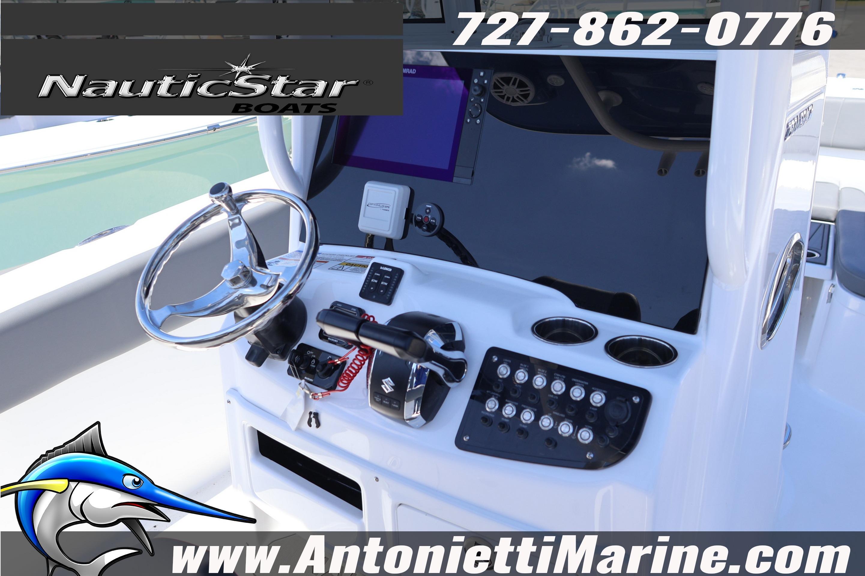 2026 NauticStar 292 Legacy boat dashboard with steering wheel and controls.