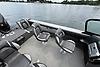 2023 Lund 1975 Tyee boat interior with swivel seats on a calm lake.
