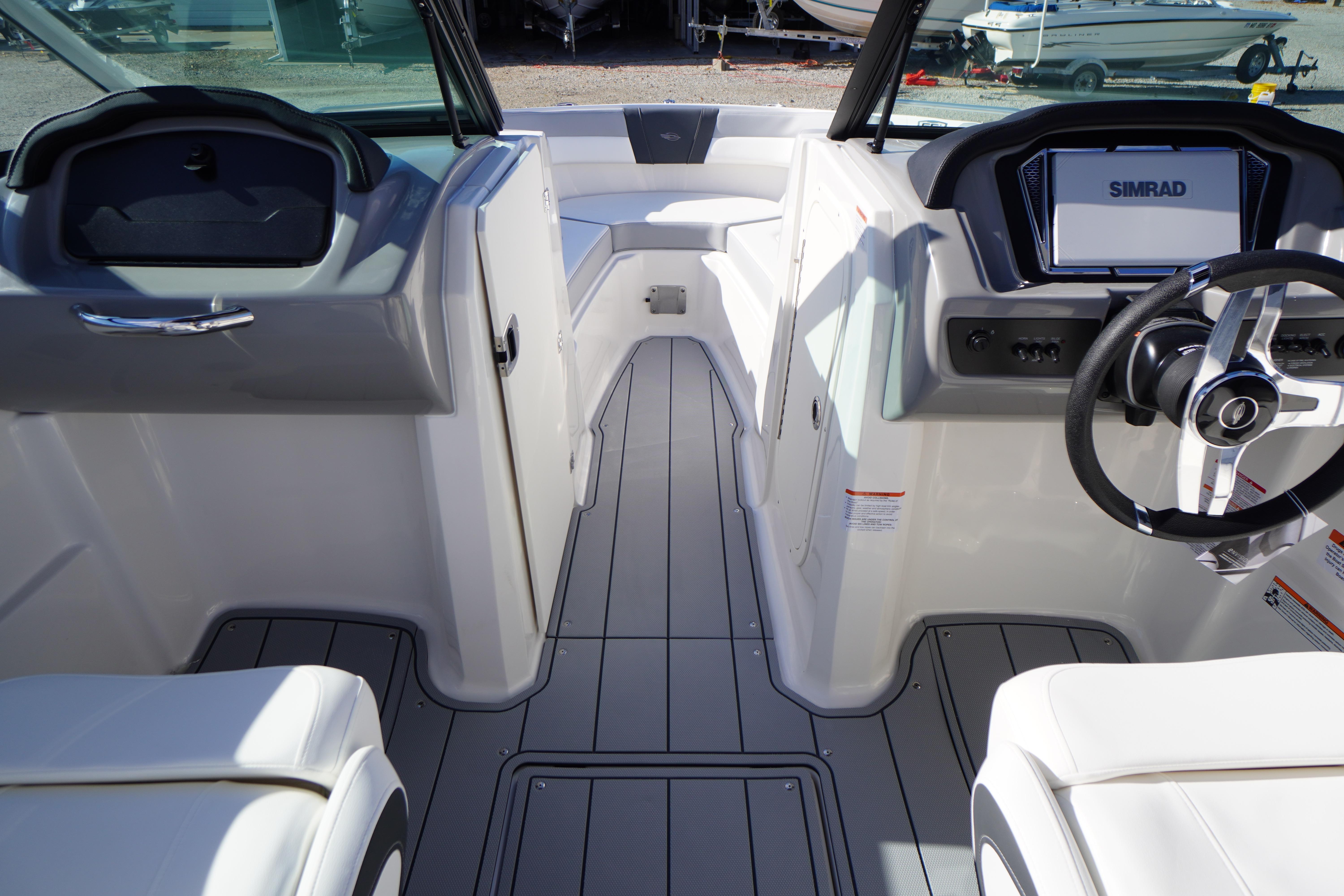 Interior view of 2026 Chaparral 23 SSi OB boat, featuring modern dashboard and seating.