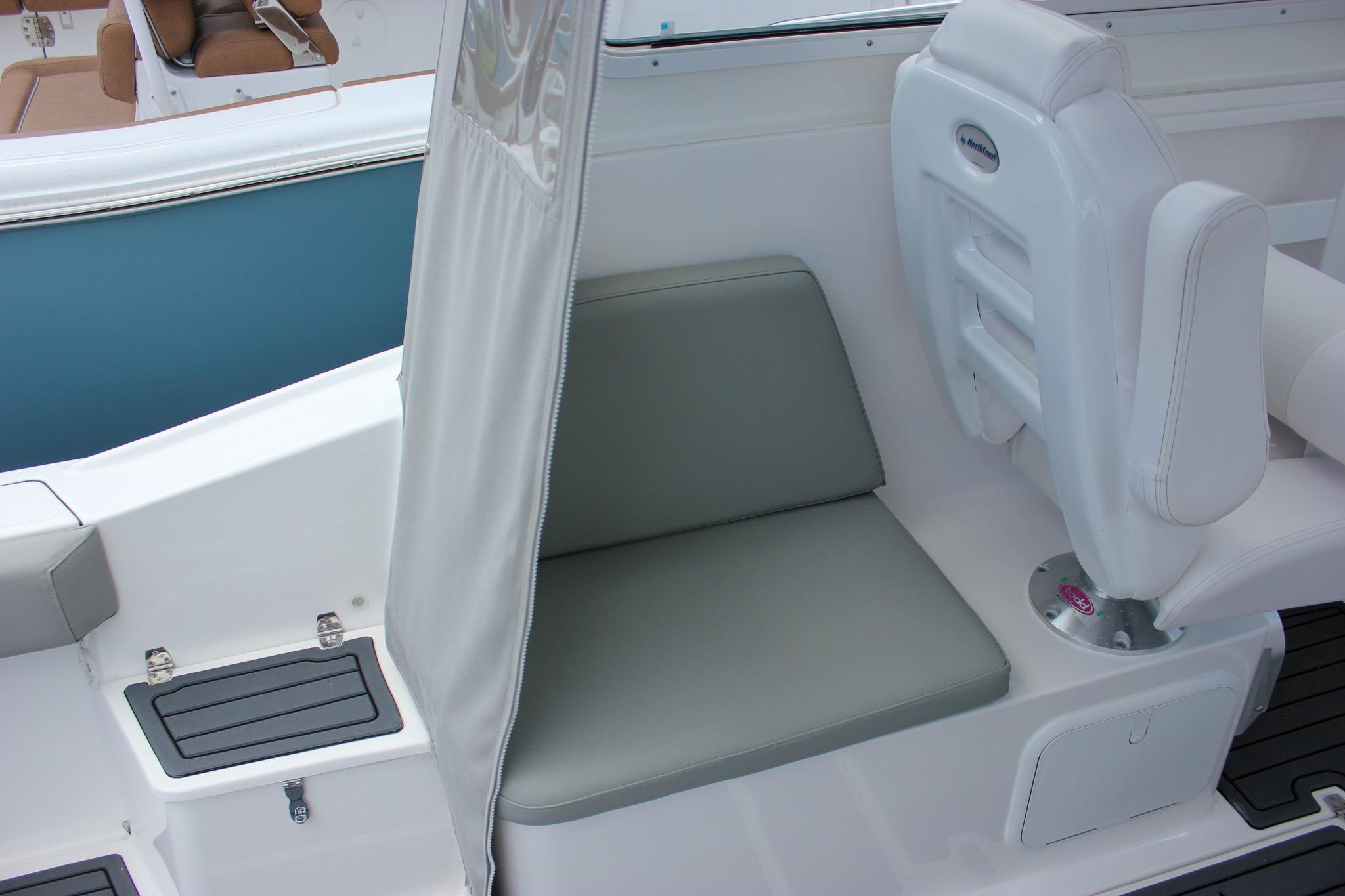 2022 NorthCoast 235 Cabin interior seating with white and gray upholstery.